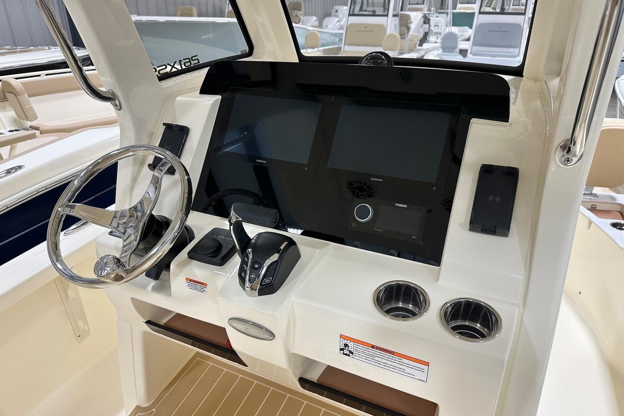 2026 Scout 261 XSS boat dashboard with steering wheel and modern controls.