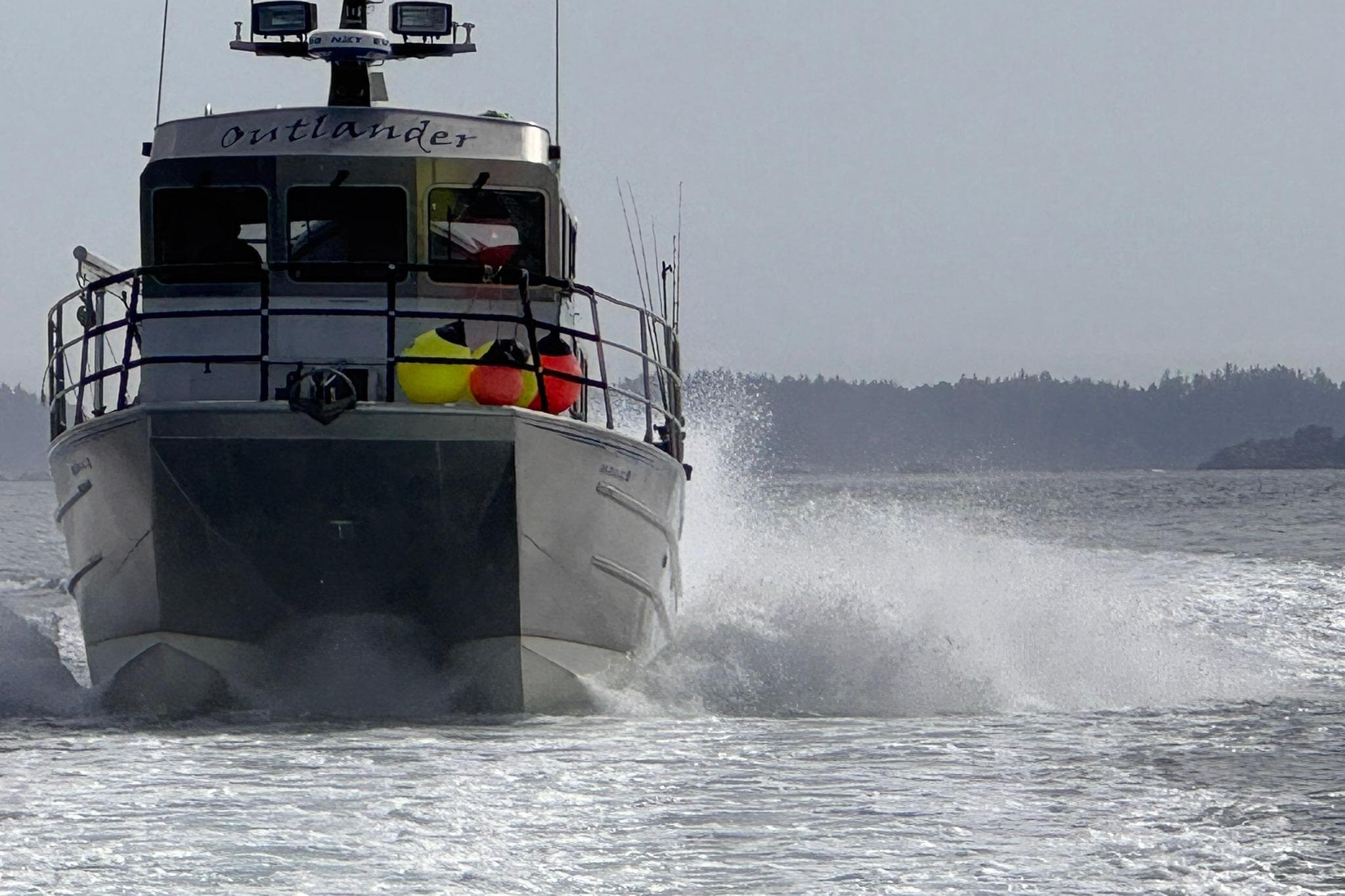 Armstrong Marine 36 Catamaran 2007 cruising on open water, creating a dynamic wake.