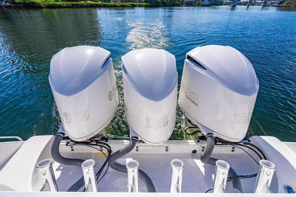 Three outboard engines on a 2019 Everglades 355 Center Console boat.