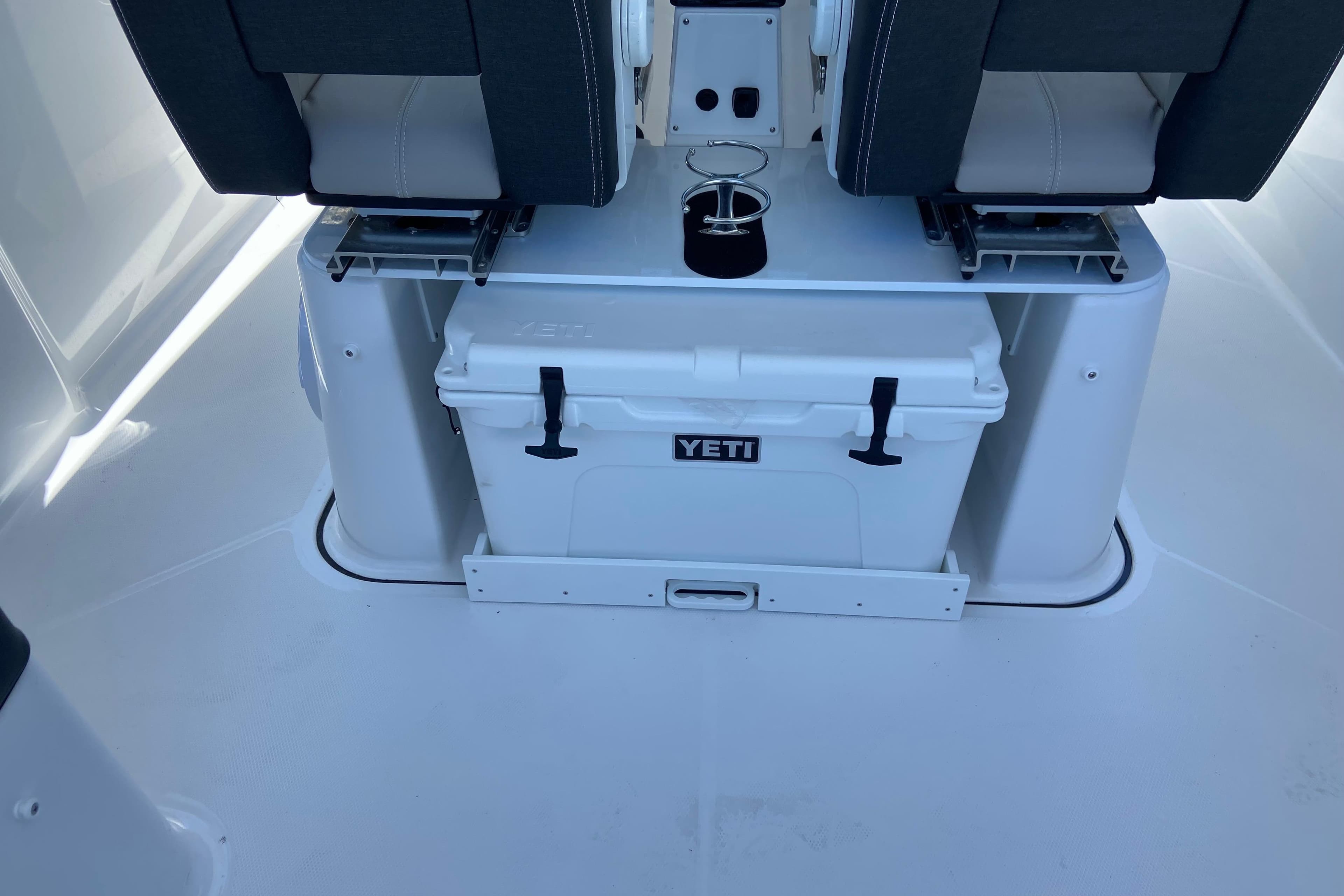 Interior of 2026 Monterey Elite 25 OB boat with Yeti cooler storage.
