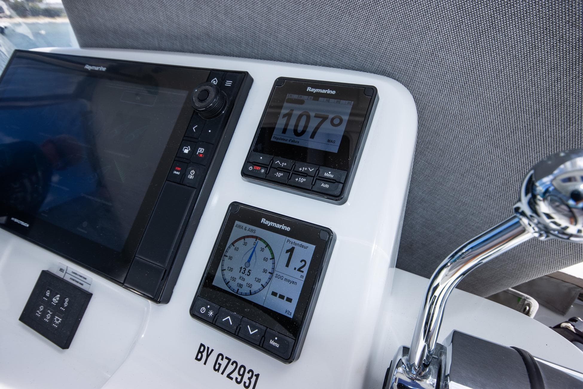 Control panel of 2024 Lagoon 51 yacht with Raymarine navigation displays.