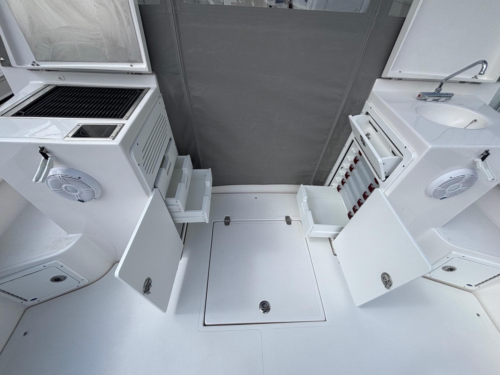 2025 NorthCoast 315 HT boat interior with storage, sink, and grill.