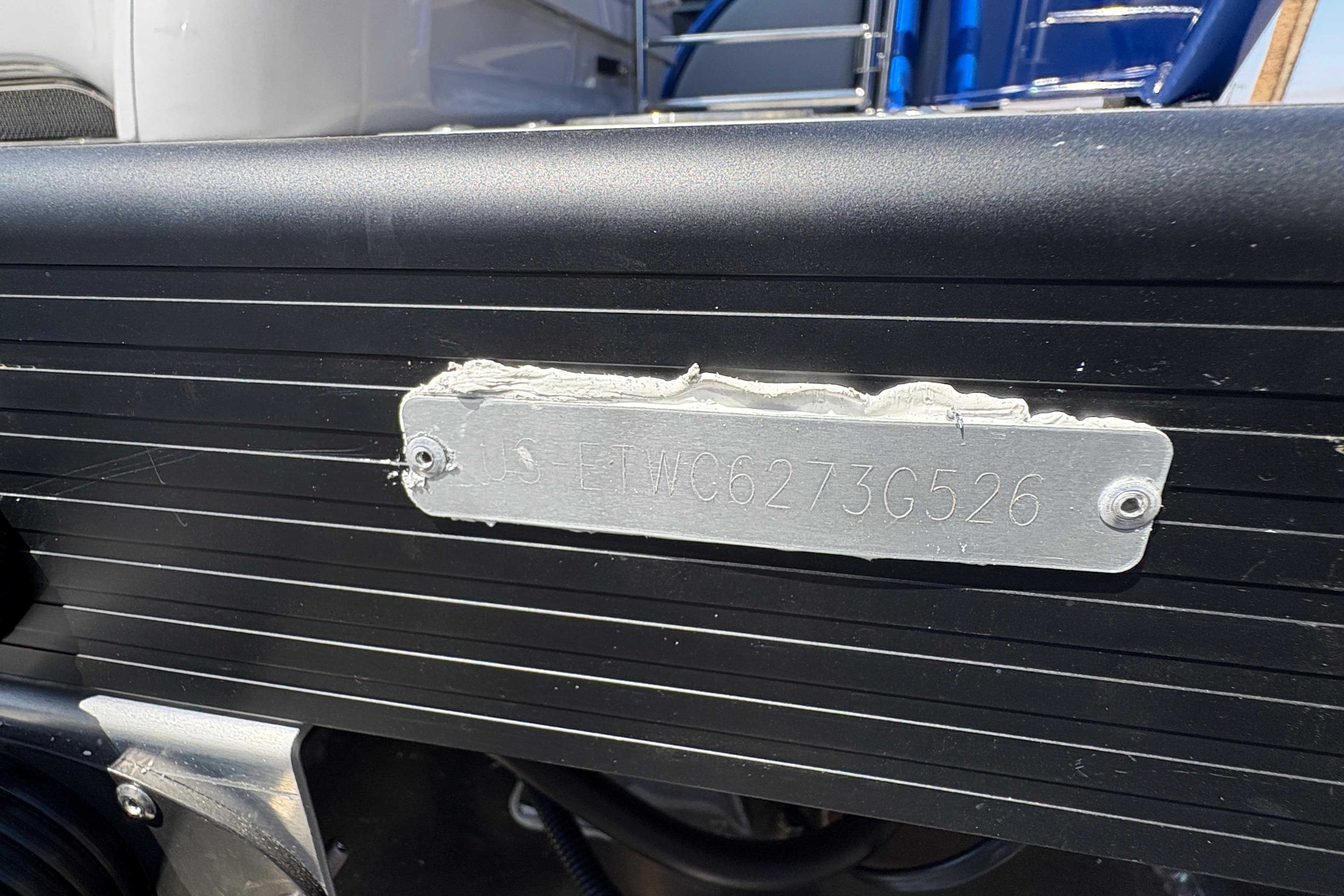 Close-up of a 2026 Bennington 27 RXSBAT2 boat's identification plate.