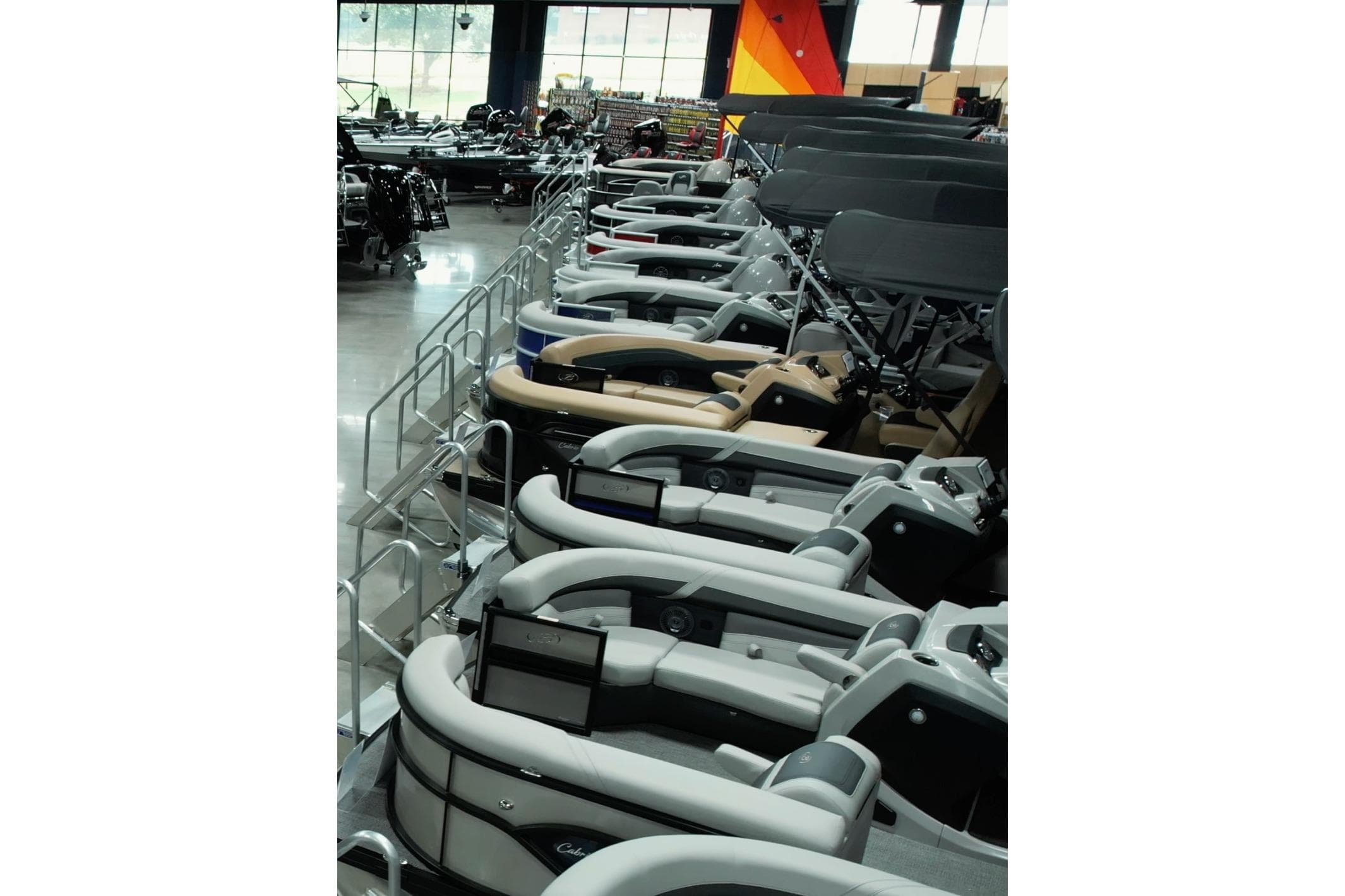 Showroom display of 2026 Barletta Aria 22CC pontoon boats, featuring sleek design and modern amenities.