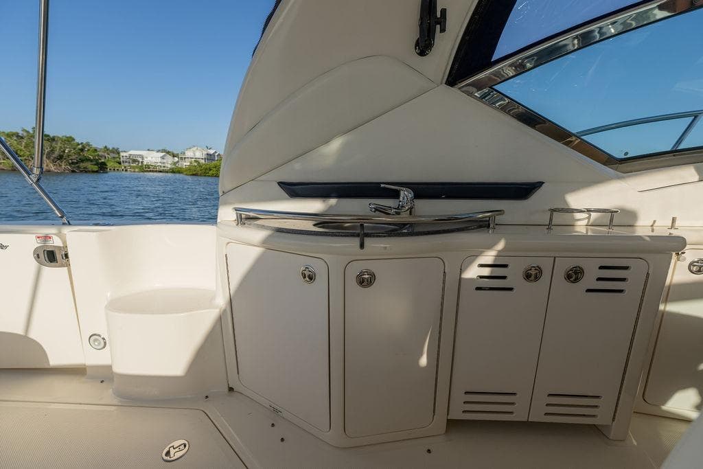 Interior view of 2005 Sea Ray 420 Sundancer yacht with sink and cabinets.