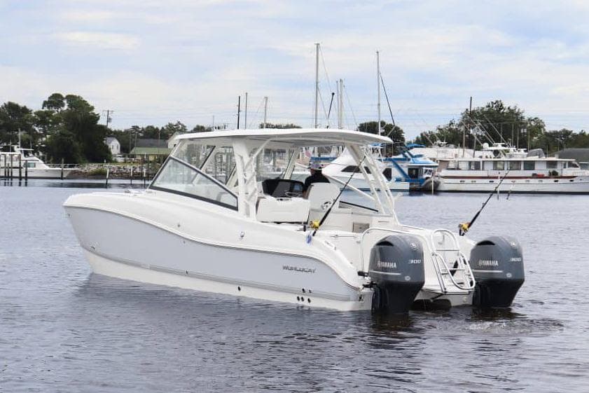 Manufacturer Provided Image: 2026 World Cat 325 DC boat with dual Yamaha engines on calm water.