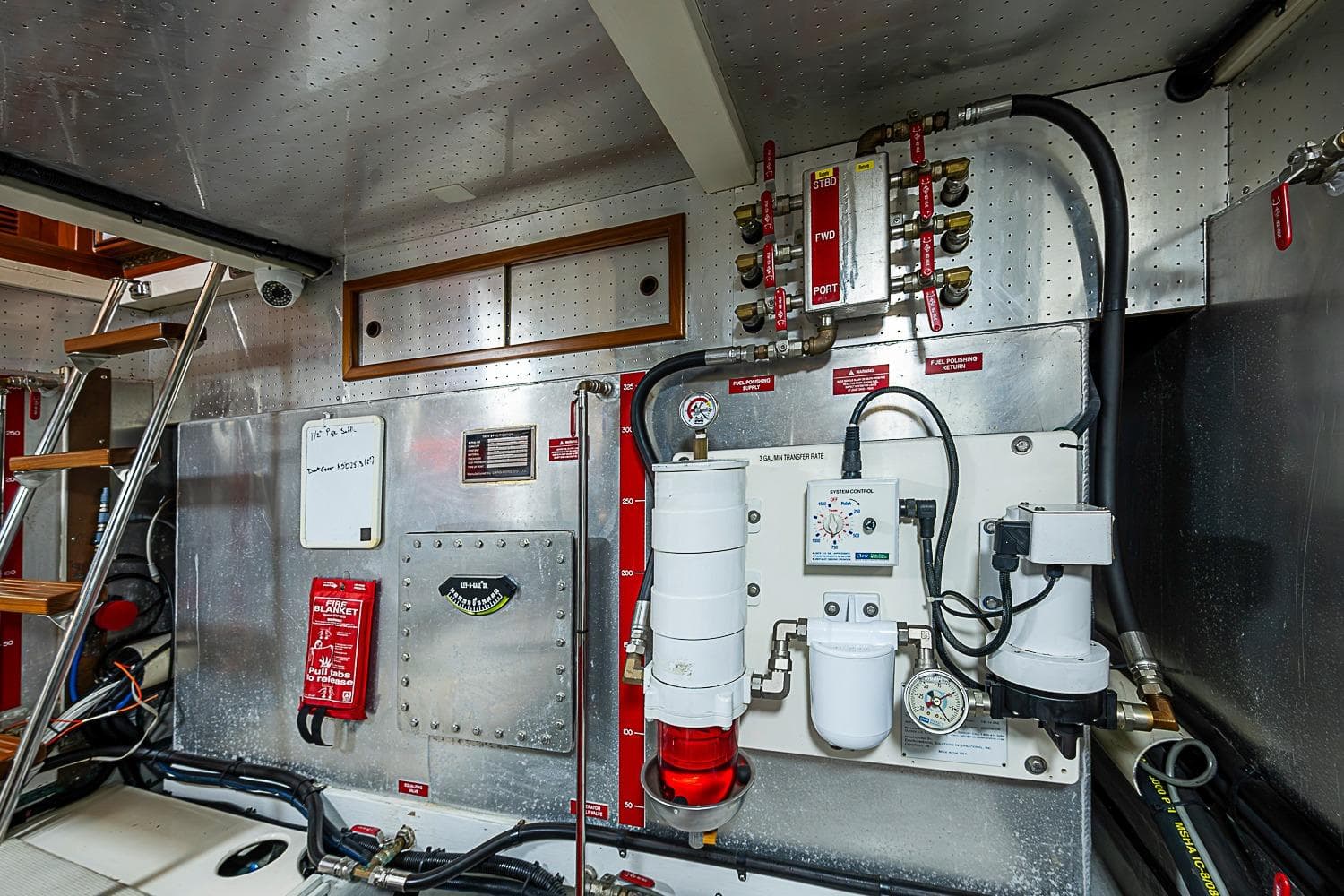 Engine room of 2008 Krogen 48 North Sea yacht, featuring control panels and equipment.