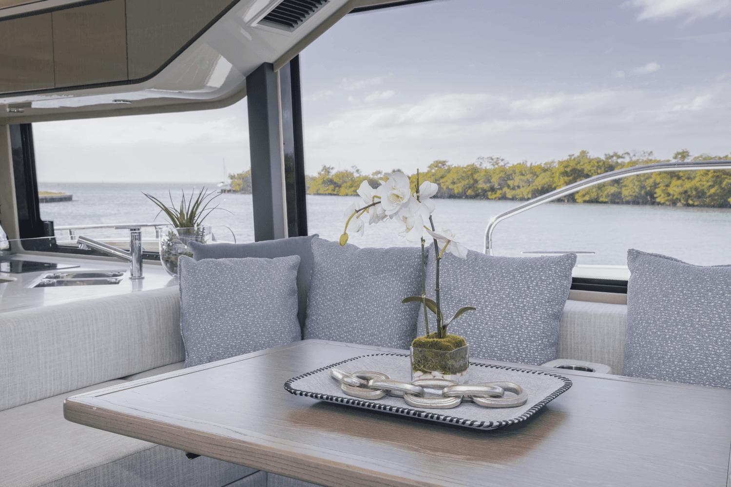 Luxurious interior of 2025 Cruisers Yachts 57 Fly with elegant decor and scenic view.