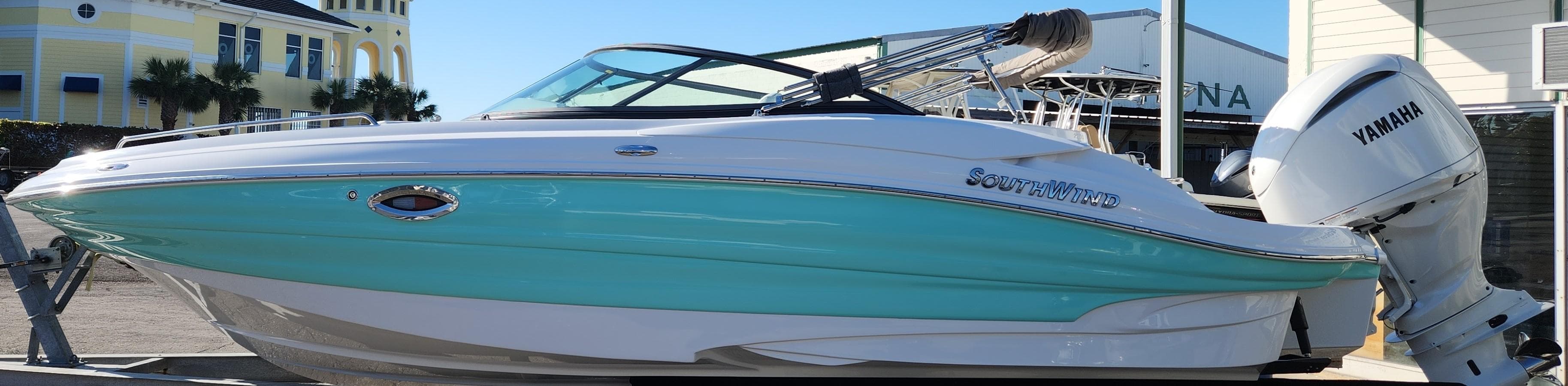 2025 SouthWind 2400 SD boat with Yamaha engine, docked at marina.