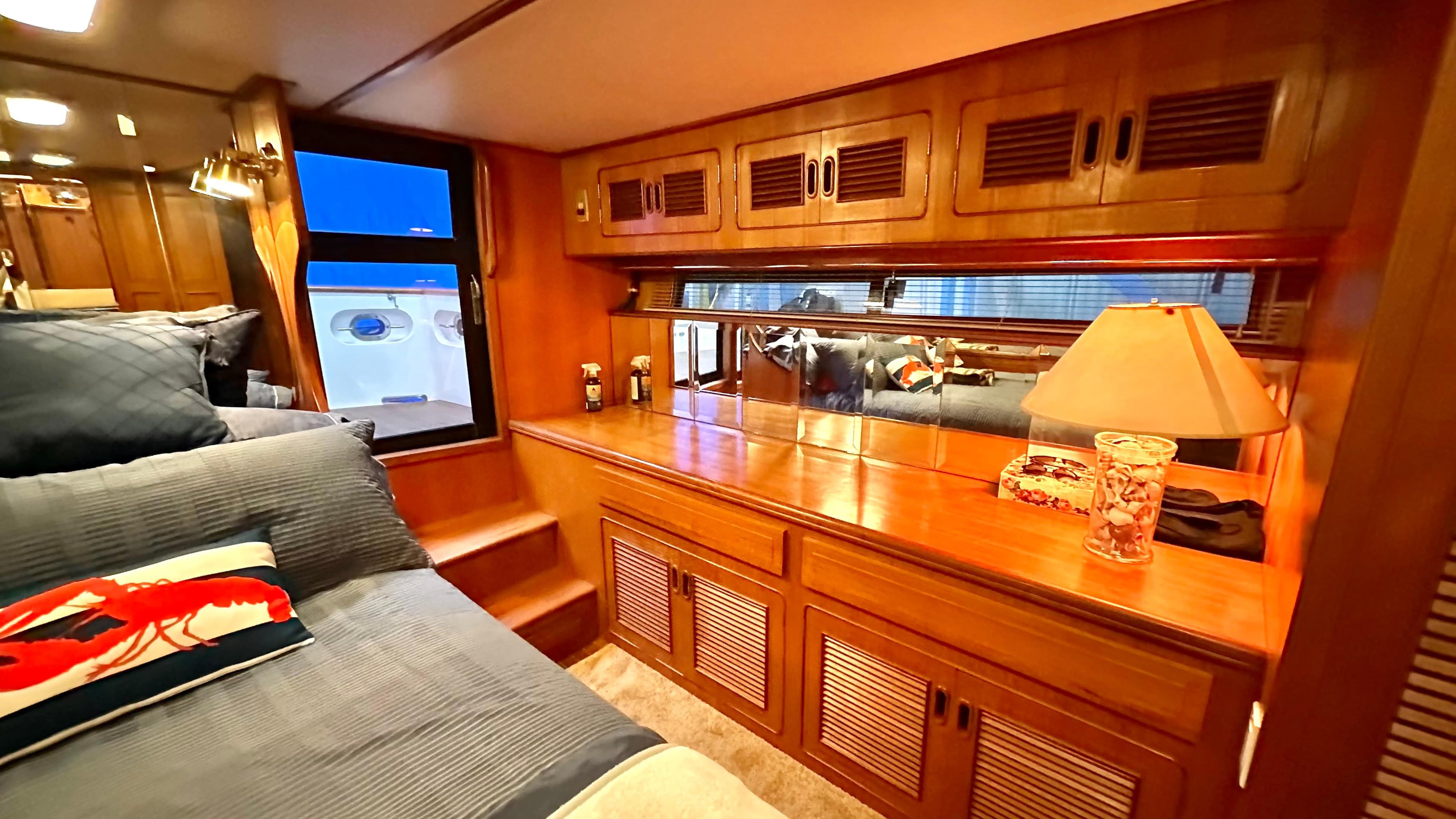Luxurious cabin interior of 1991 Custom Trans World Del-Ray 53 yacht with wood finish.