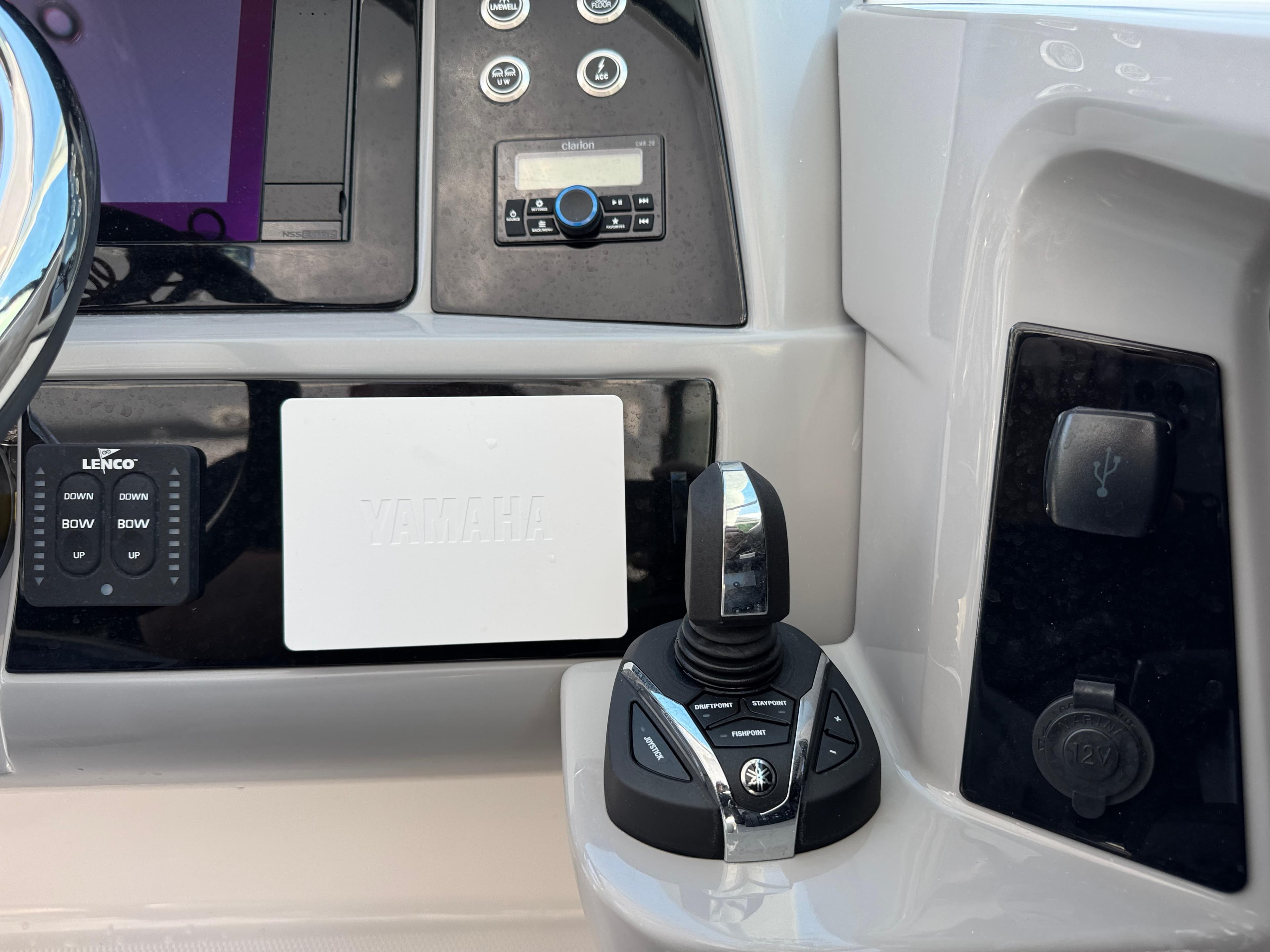 Control panel of 2024 Robalo R317 boat featuring joystick and electronic controls.