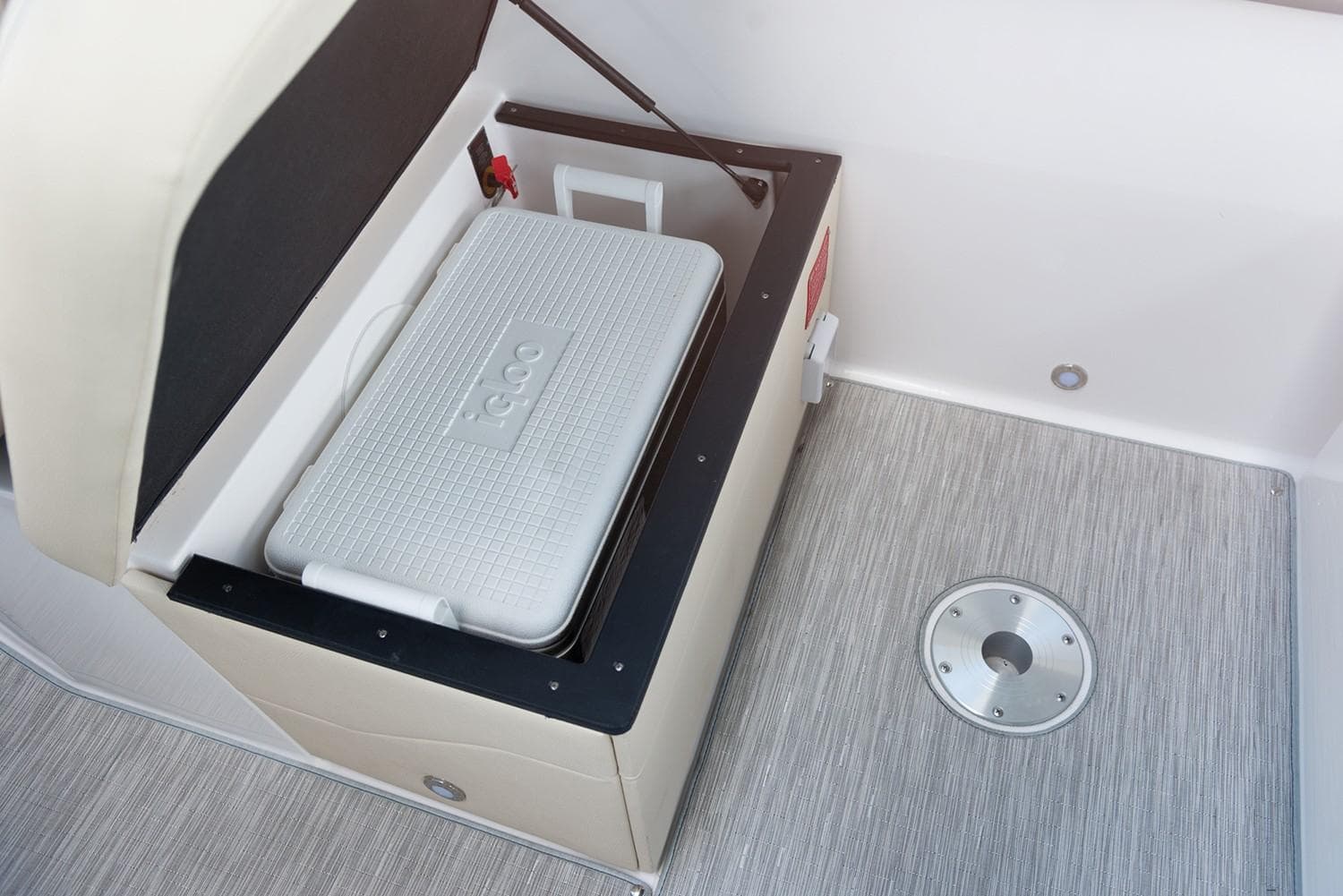 Manufacturer Provided Image: 2026 Regal 26 XO boat interior with storage compartment and cooler.