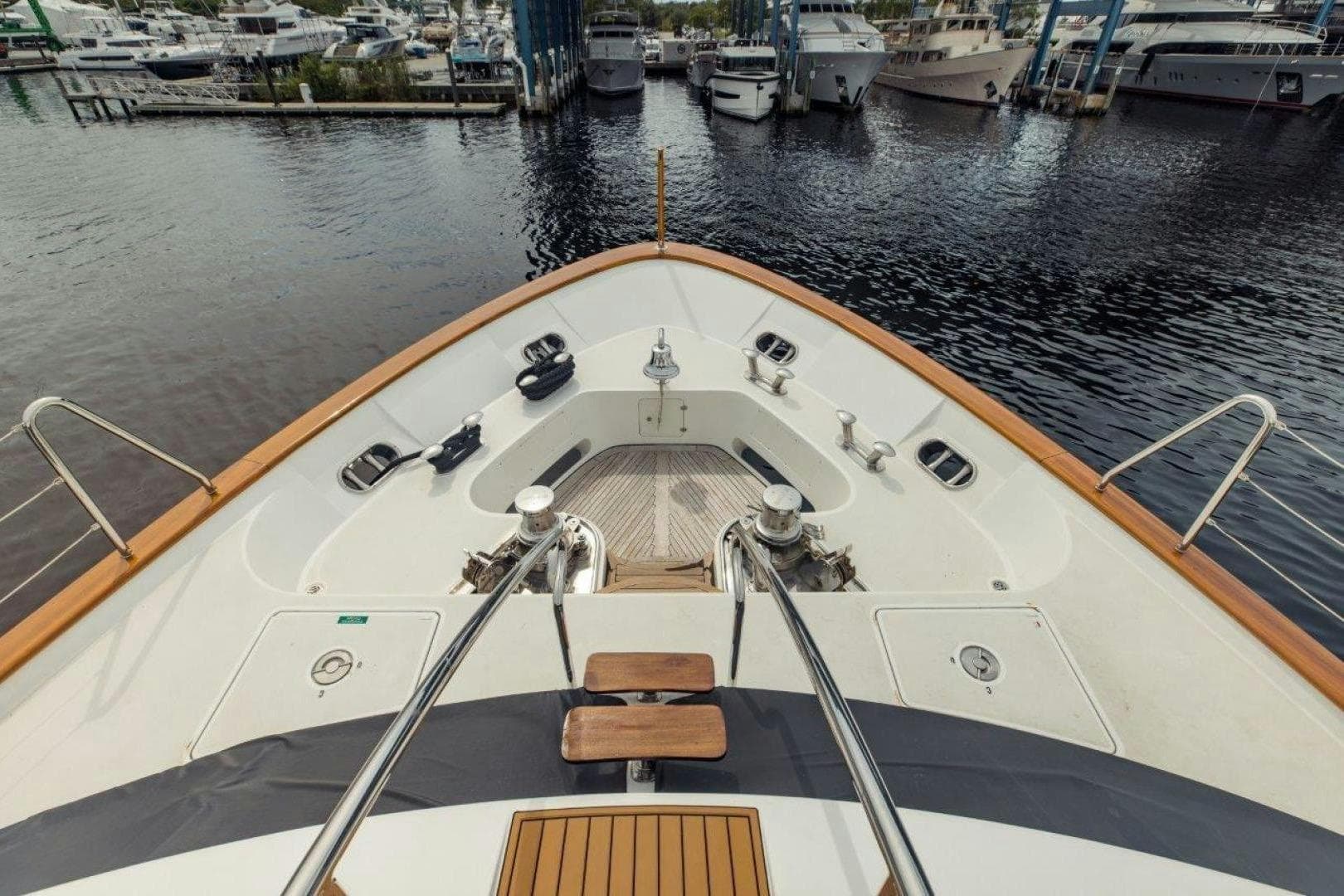 Bow view of 2007 Benetti 120 Classic yacht docked at marina.
