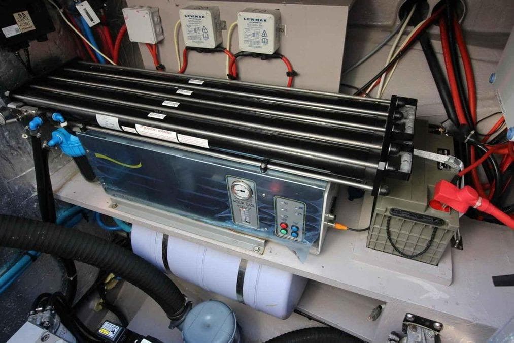 Engine room of a 2021 Bali 5.4 Open Space yacht with complex wiring and equipment.