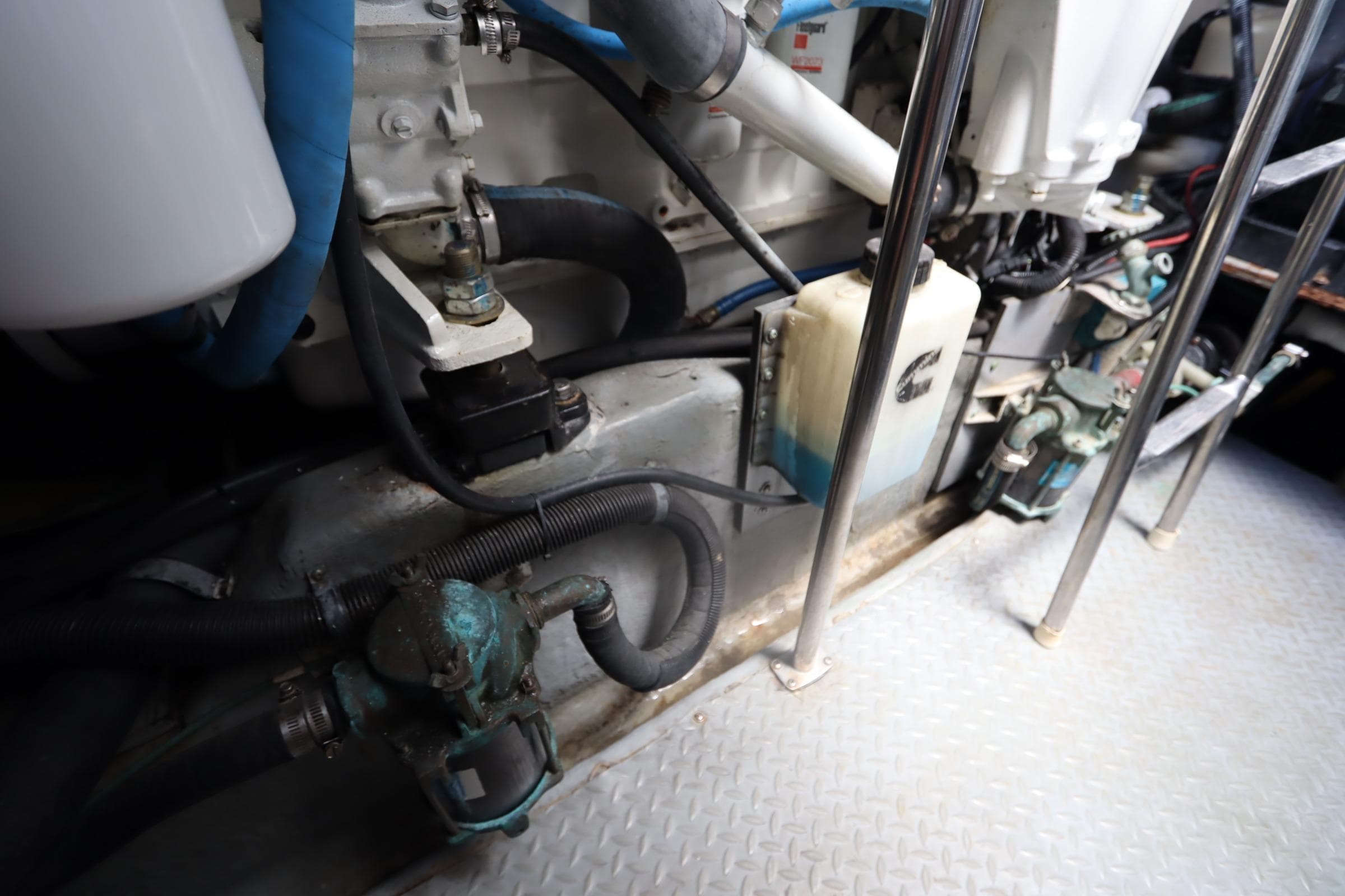 Engine room of 2000 Sea Ray 460 Sundancer with visible components and piping.