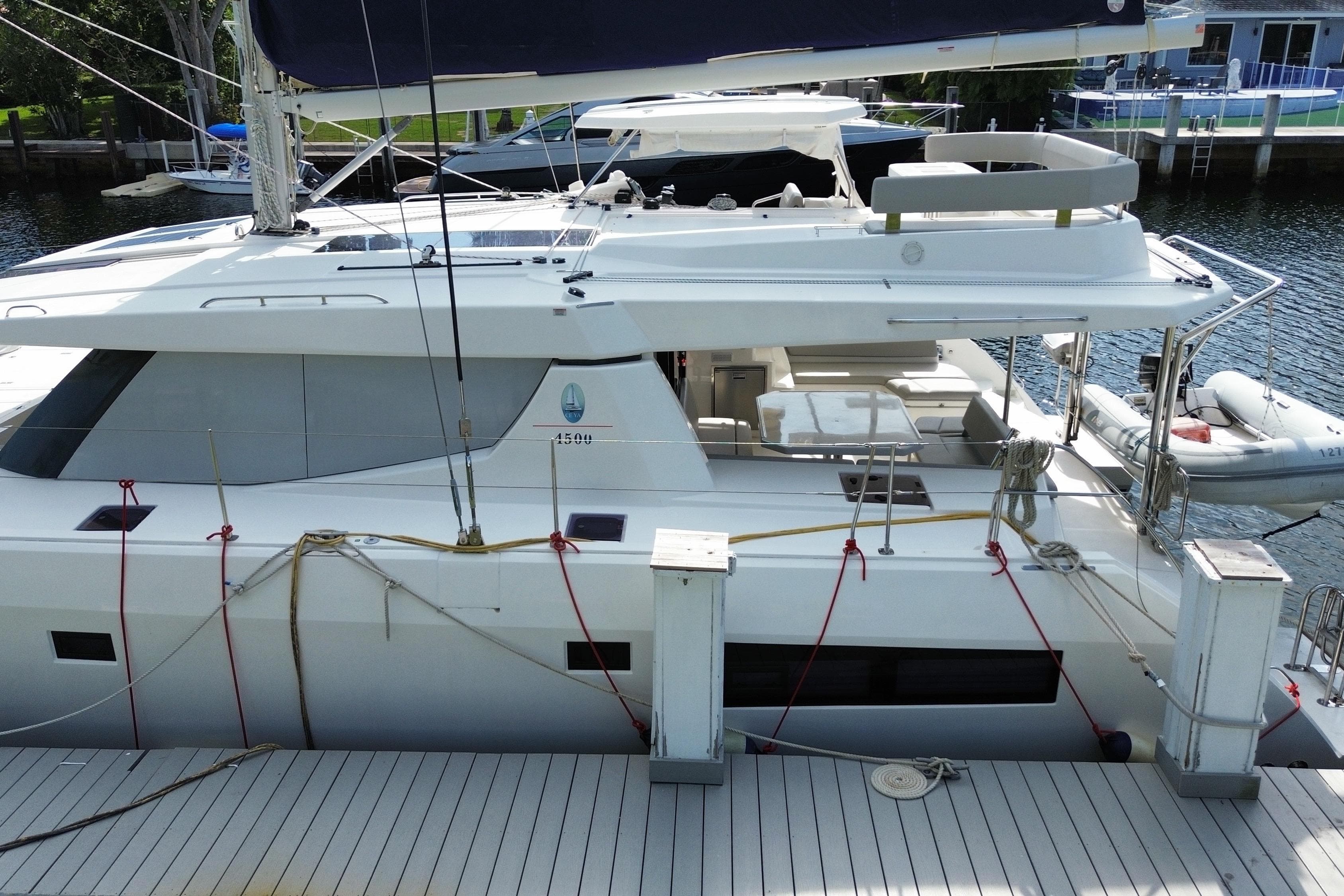 2021 Leopard 45 catamaran docked, featuring spacious deck and modern design.