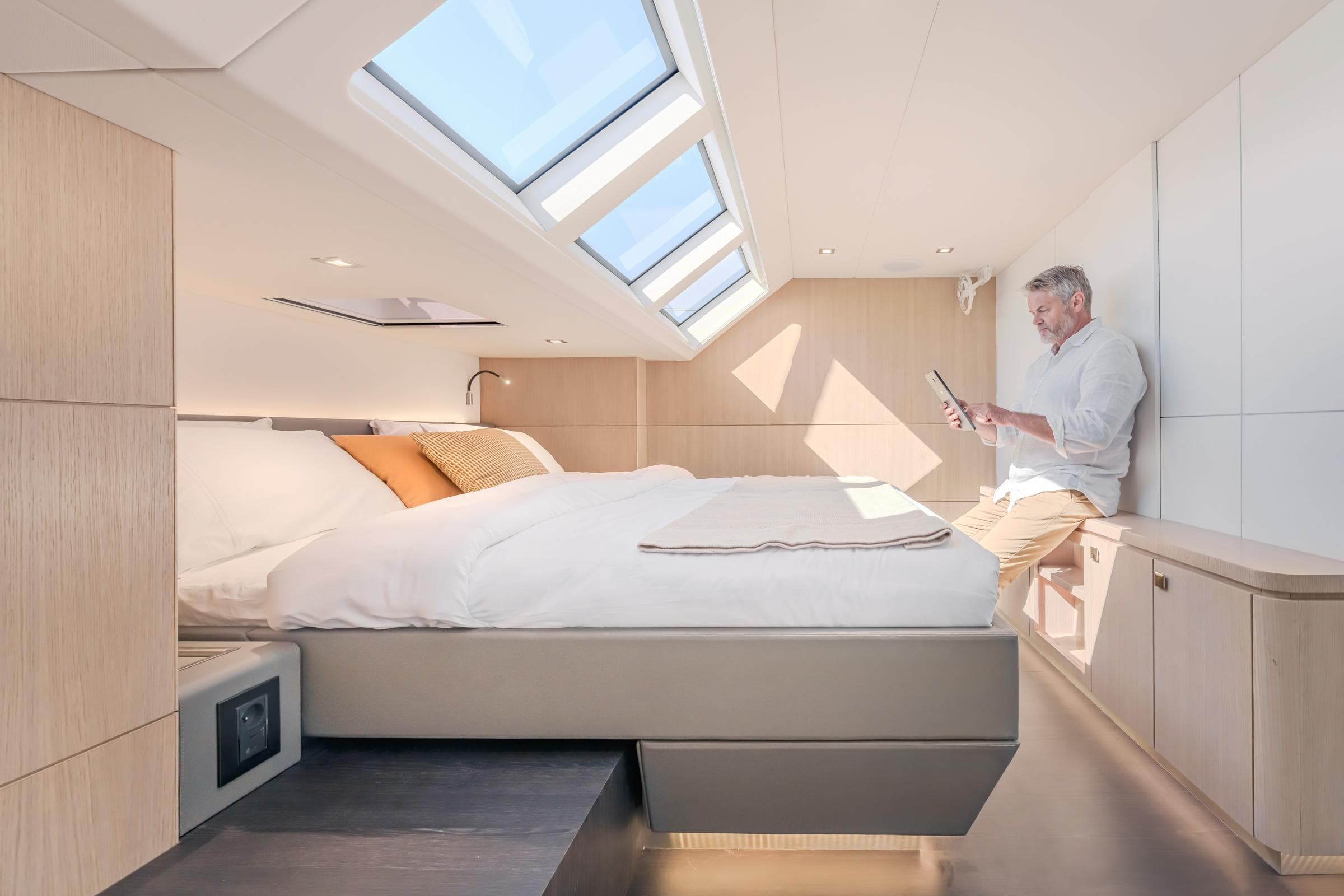 Luxurious cabin interior of 2025 Privilege Signature 650 yacht with skylights and modern design.