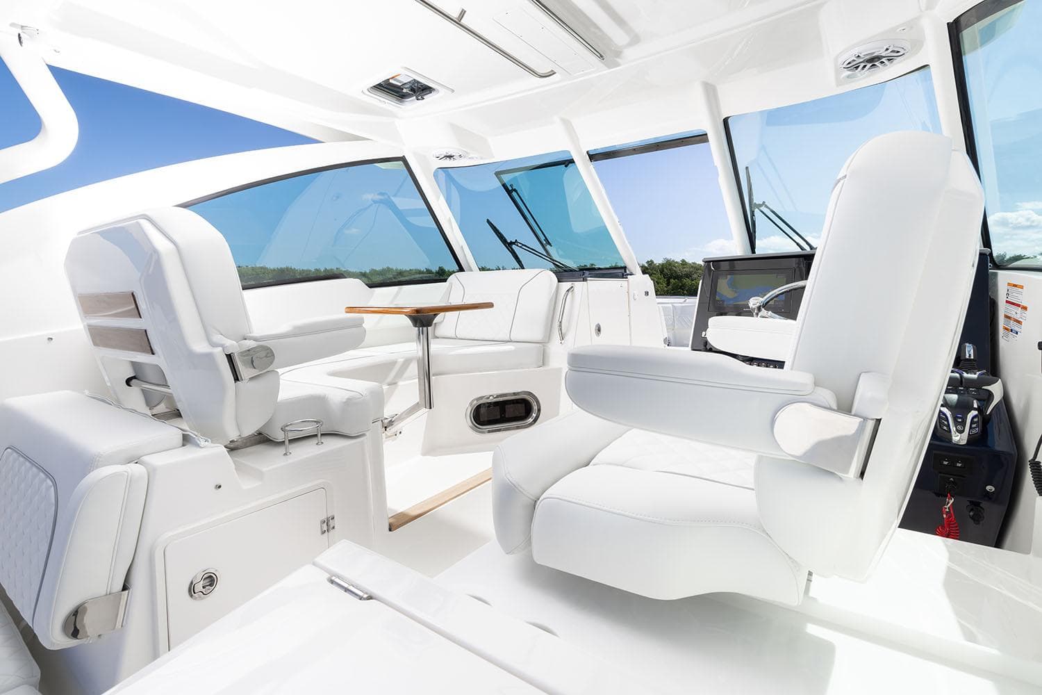 Manufacturer Provided Image: Interior of 2025 Pursuit DC 326 Dual Console boat with white seating and modern design.