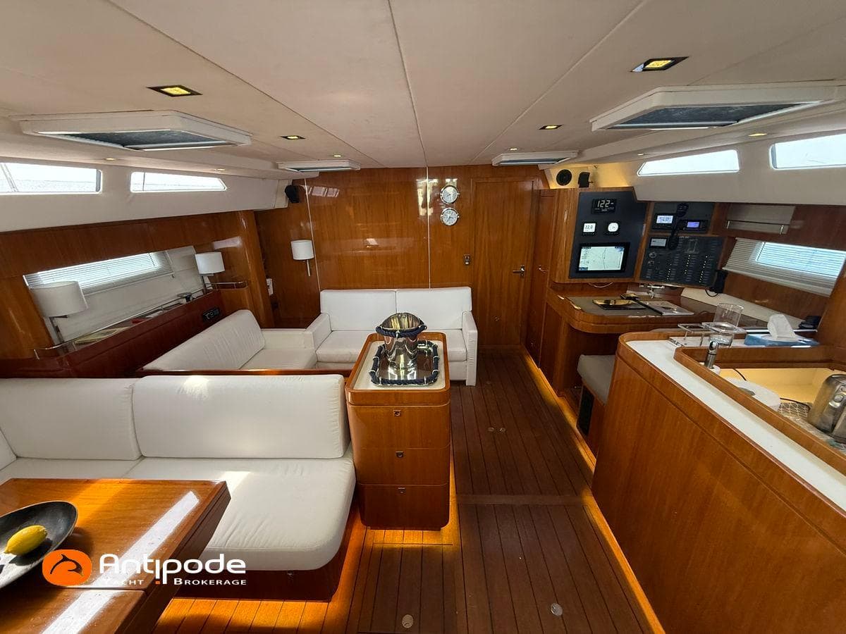 Luxurious interior of 2010 Amel 64 yacht with elegant wood finish and modern amenities.