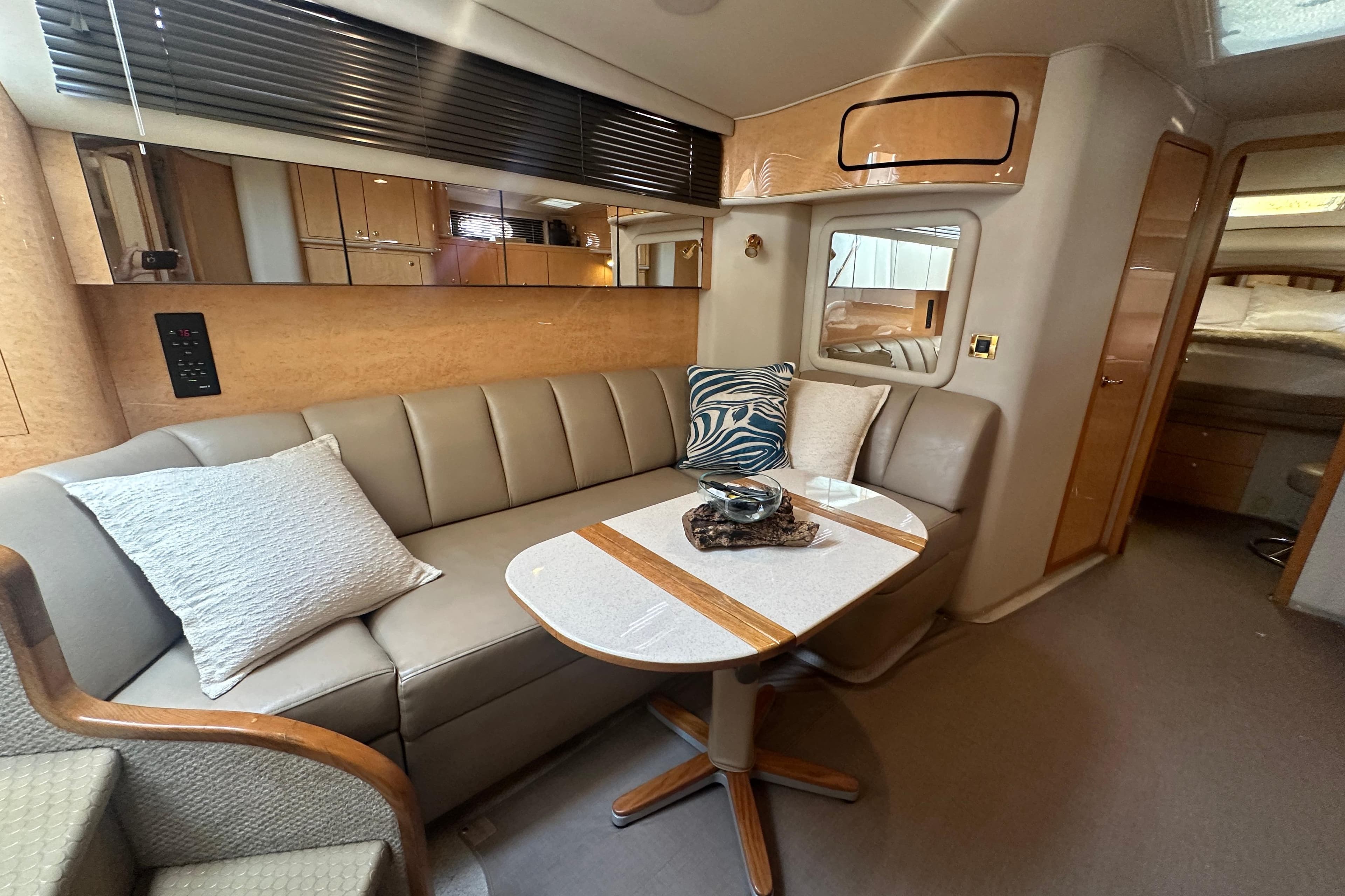 Luxurious interior of 1998 Sea Ray 450 Sundancer yacht with elegant seating and decor.
