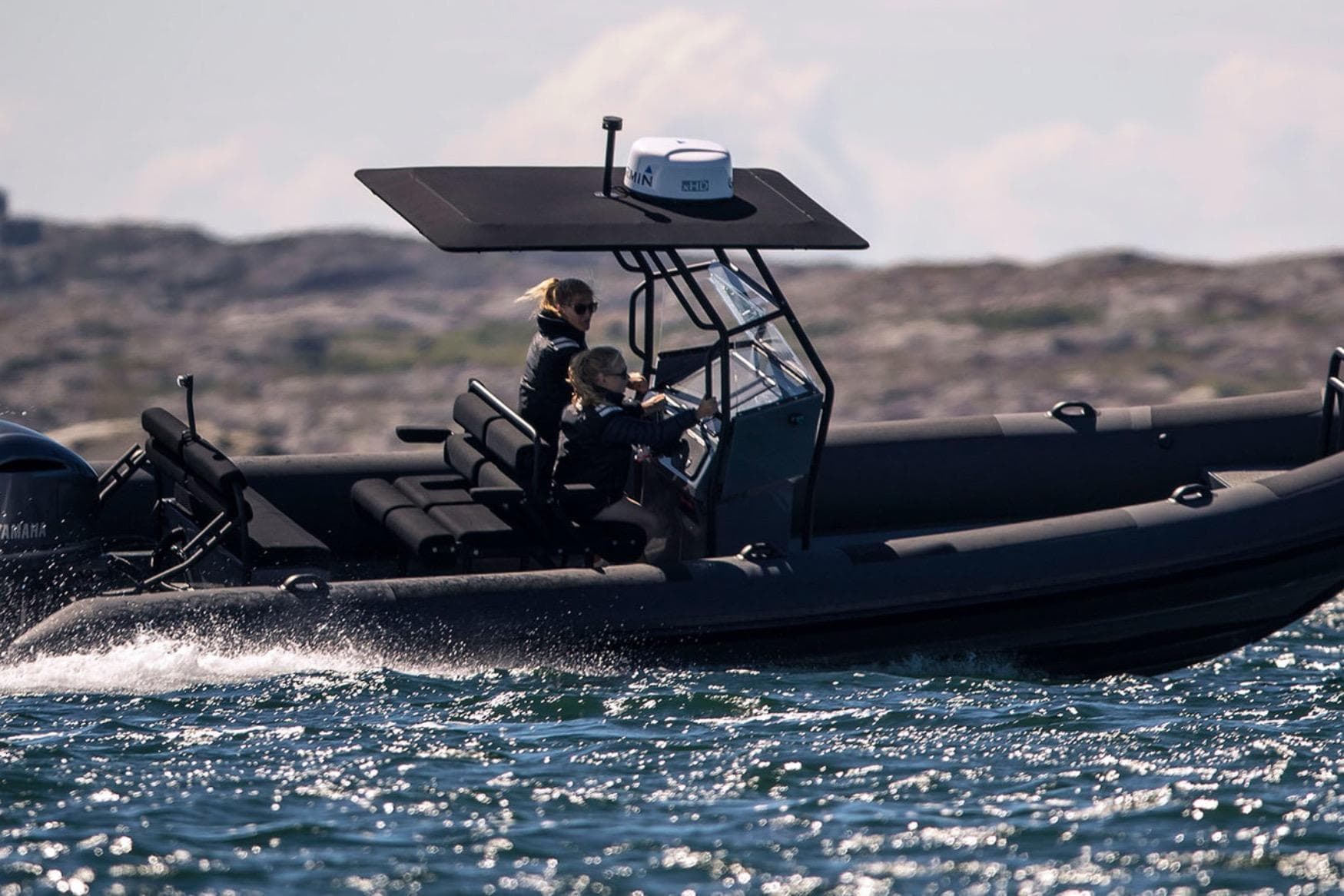 2026 Rupert R8 boat cruising on open water with passengers.