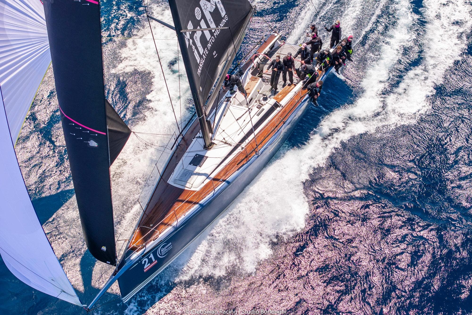 Aerial view of 2018 Nautor Swan ClubSwan 50 sailing on open water.