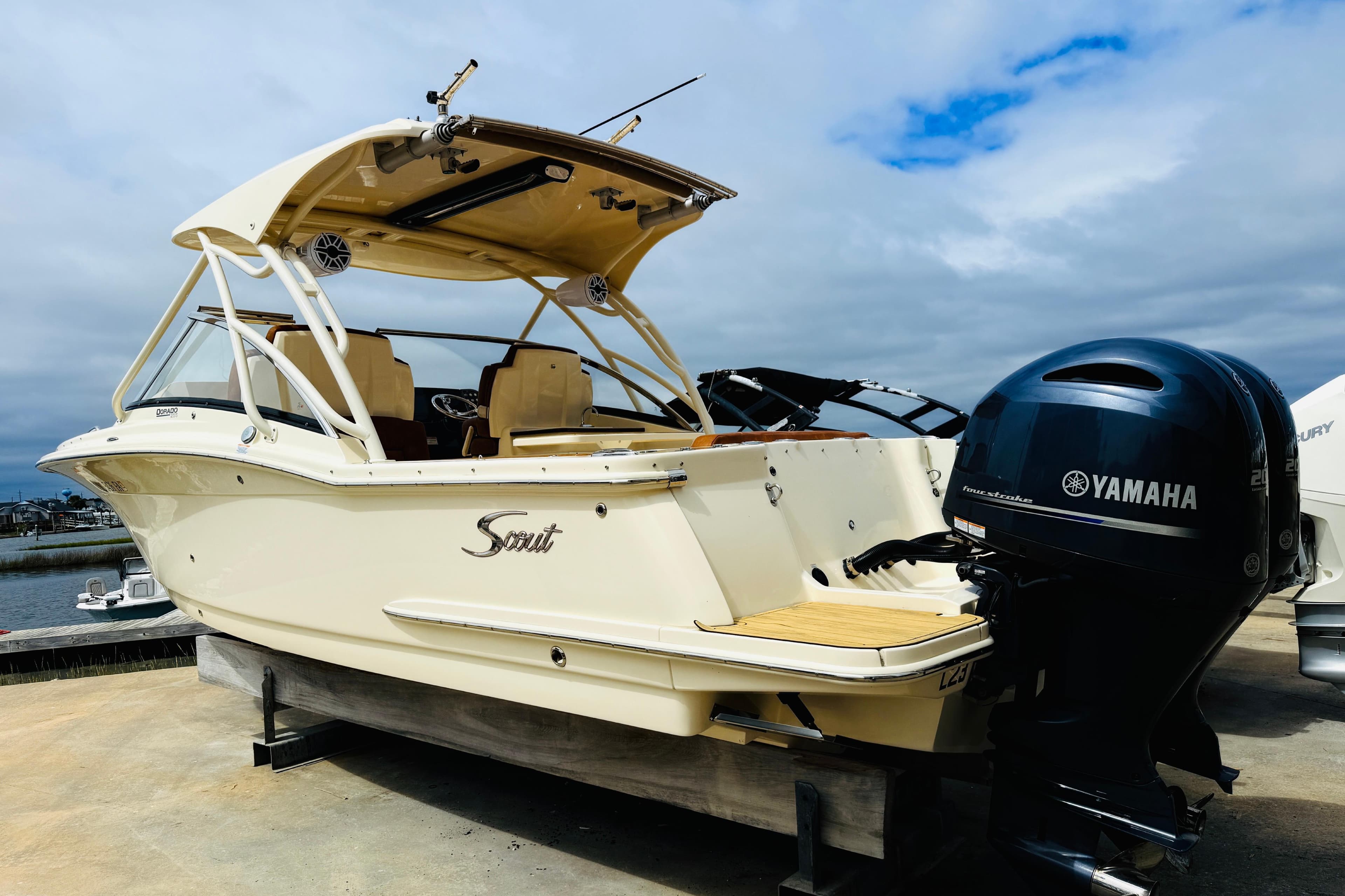 2023 Scout 255 Dorado boat with Yamaha outboard motor on display.