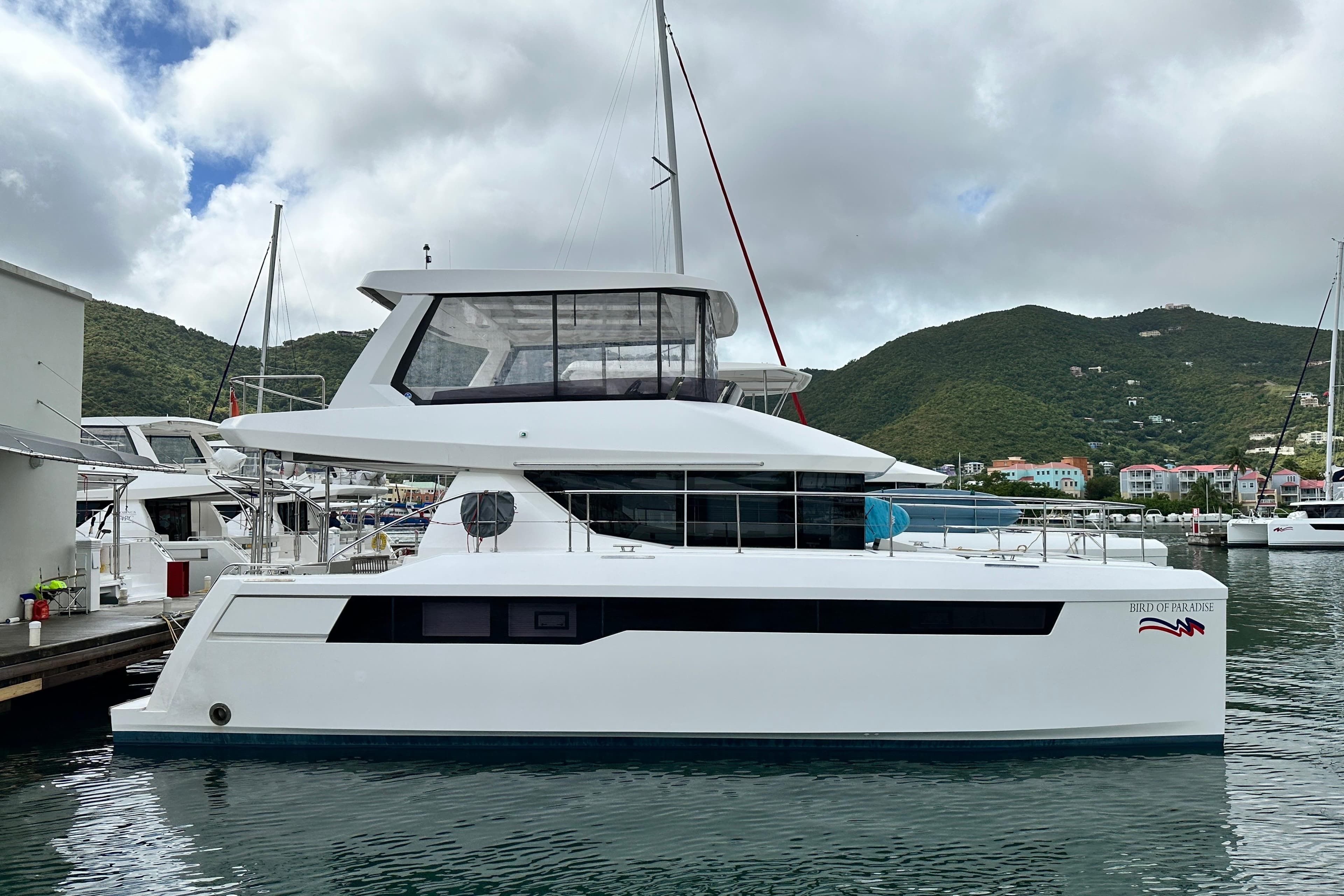 2025 Robertson and Caine Leopard 40 Powercat docked in a scenic marina.