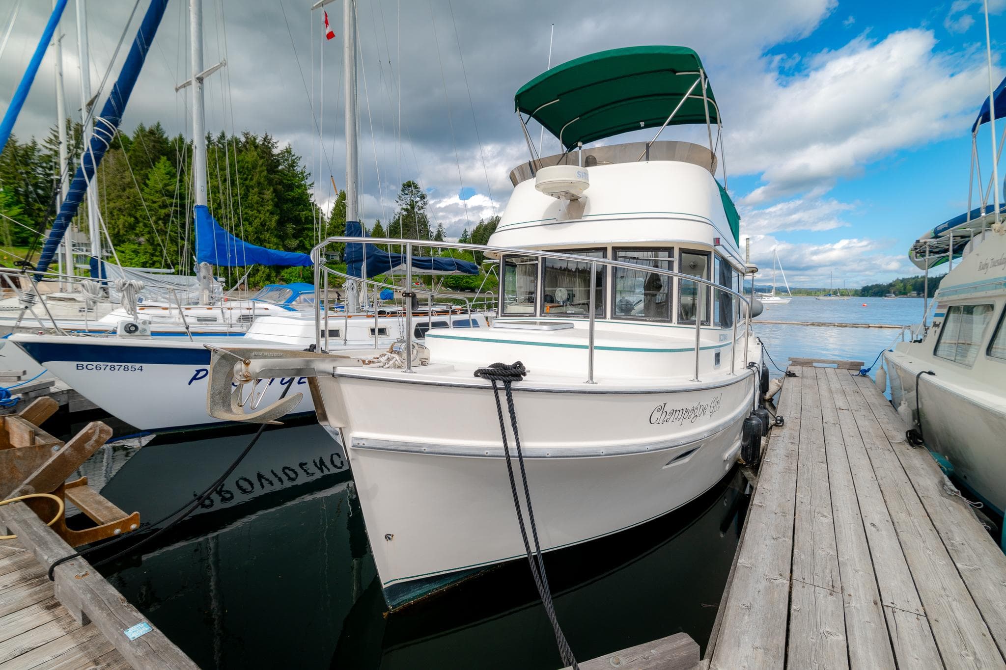 1996 Camano 31 boat docked at marina.