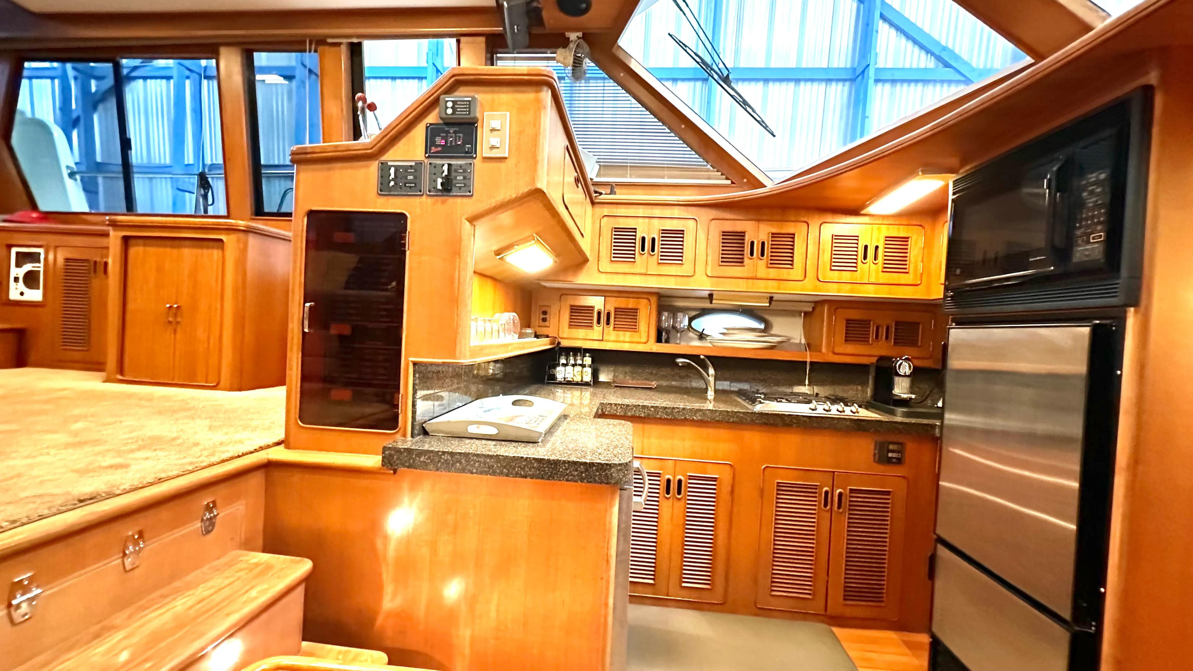 Luxurious 1991 Custom Trans World Del-Ray 53 yacht interior with modern kitchen amenities.