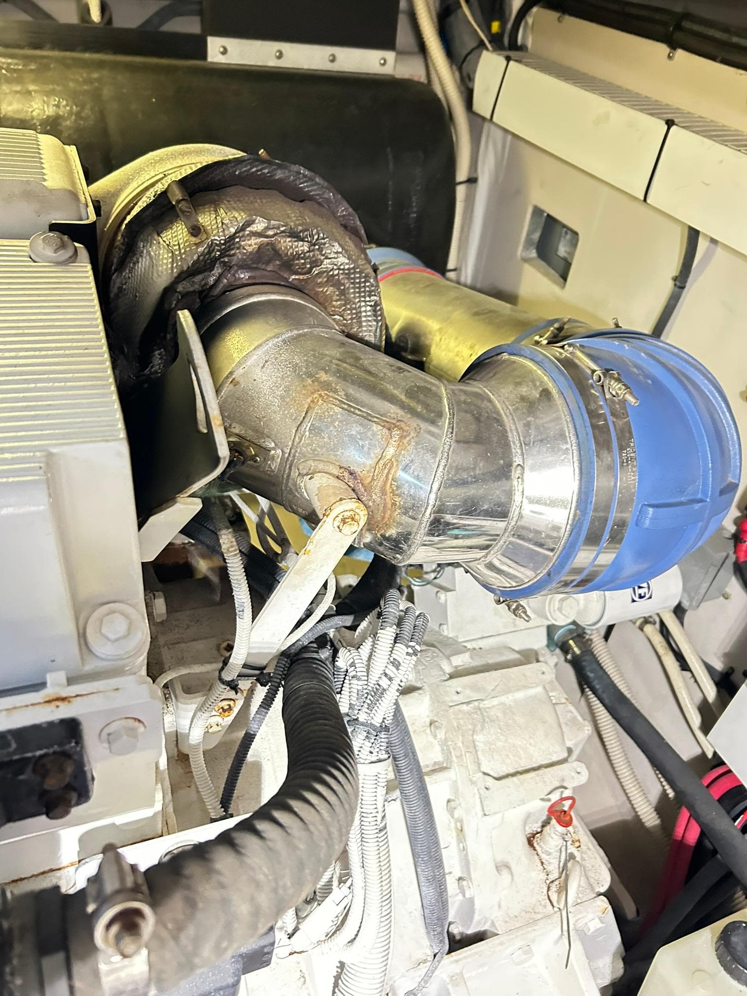 Engine compartment of a 2007 Sea Ray 52 Sundancer yacht, showcasing mechanical components.