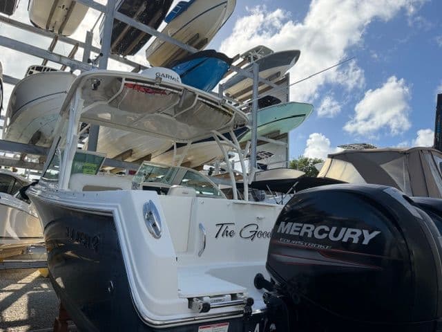 2016 Sailfish 275 DC boat with Mercury engine in storage.