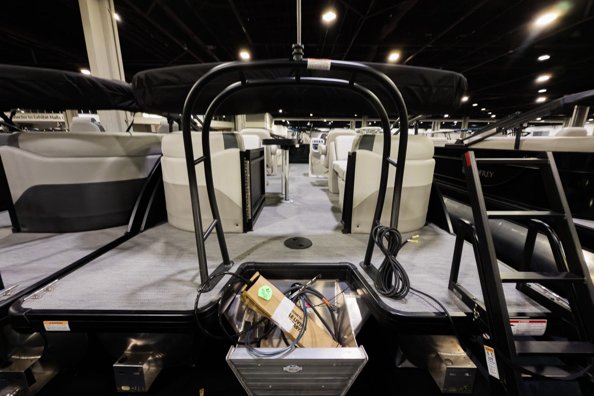2026 Godfrey Sweetwater 22' Split Bench Tritoon interior with seating and equipment.