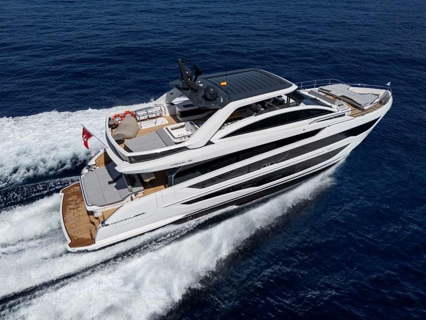 Luxurious 2026 Pearl 82 yacht cruising on open sea, showcasing sleek design and elegance.