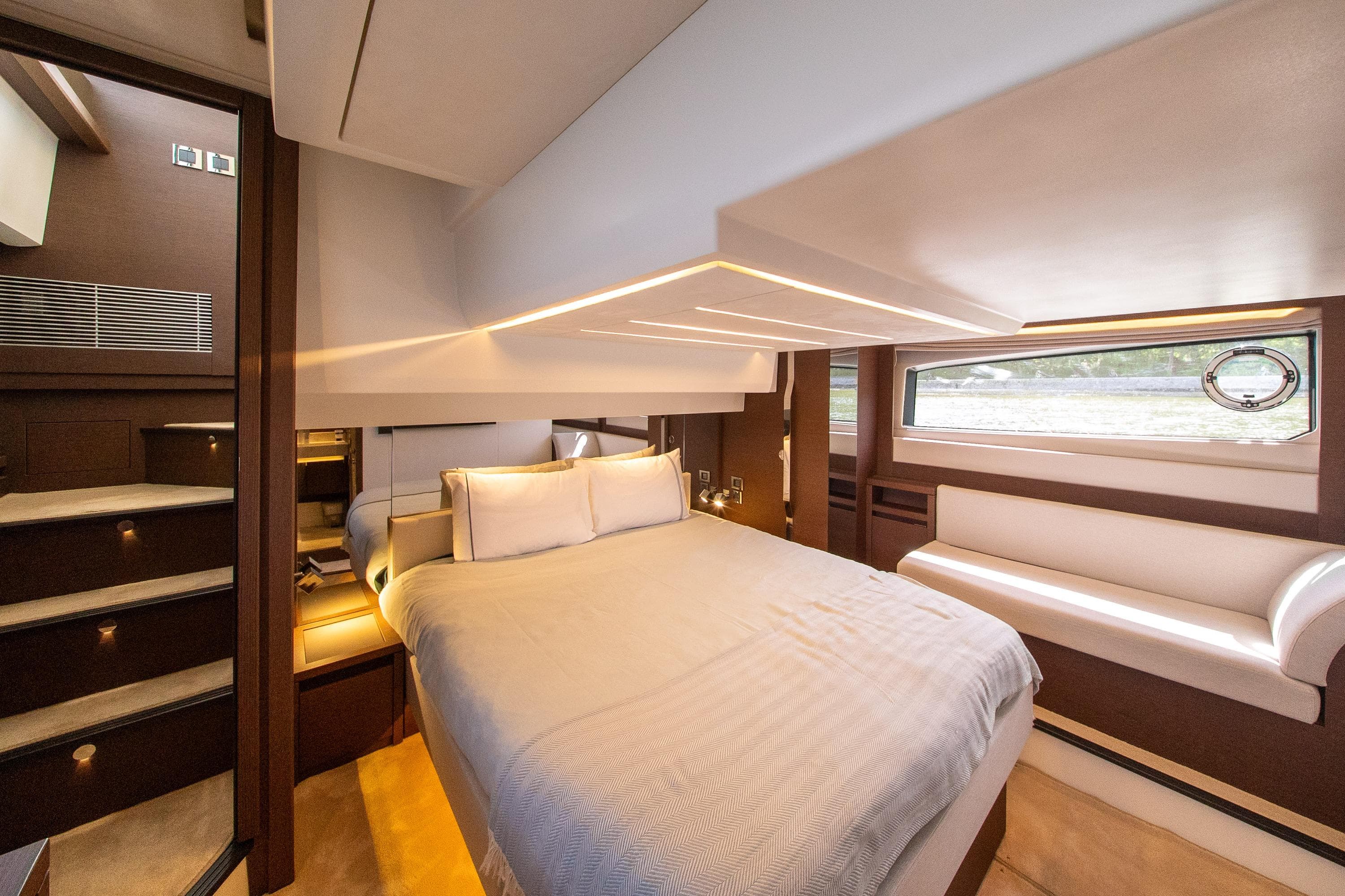 Luxurious interior of 2022 Prestige 520 yacht with elegant bedroom design.