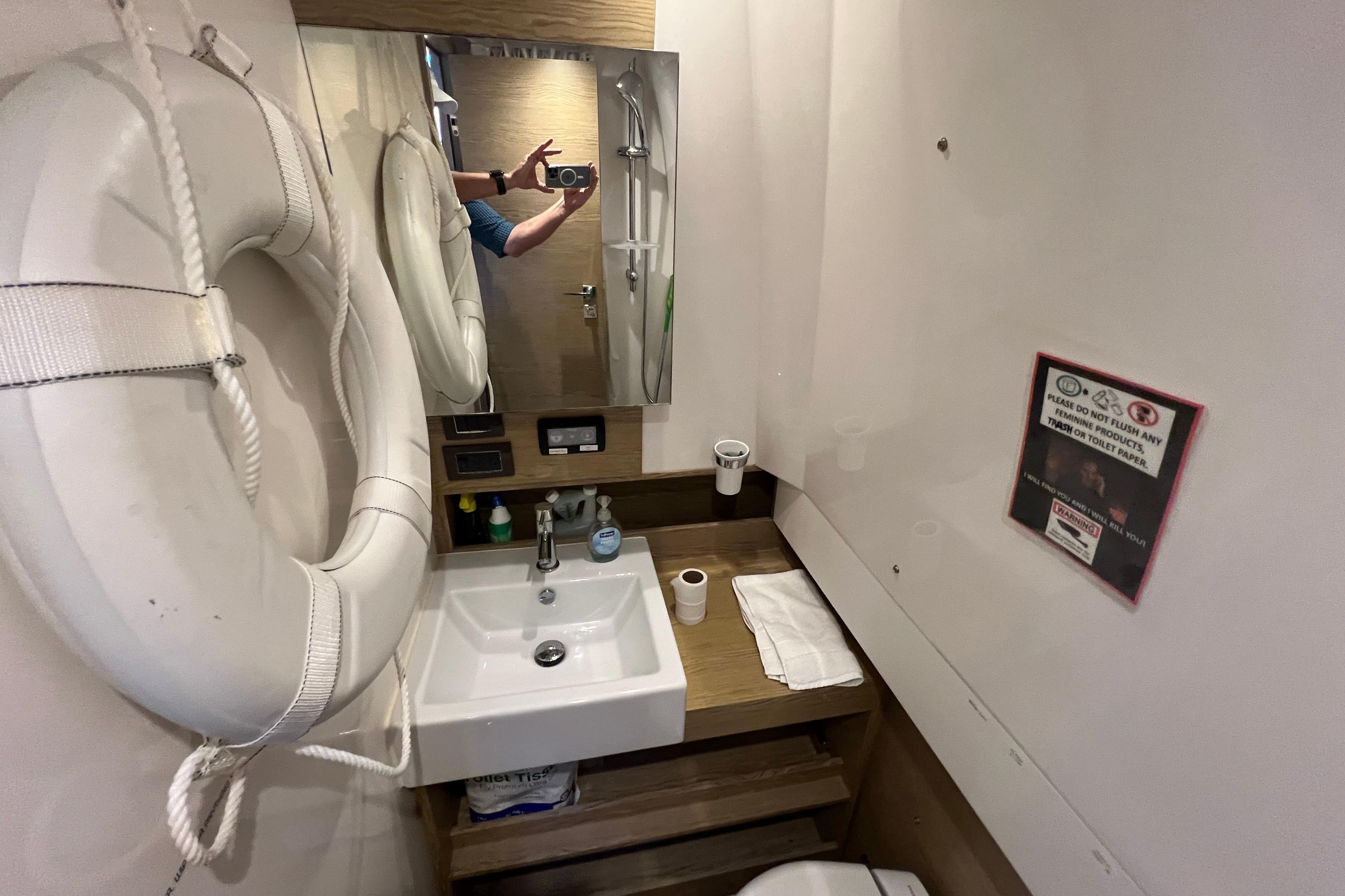 Bathroom interior of 2018 Azimut Verve 40 yacht with sink and life preserver.