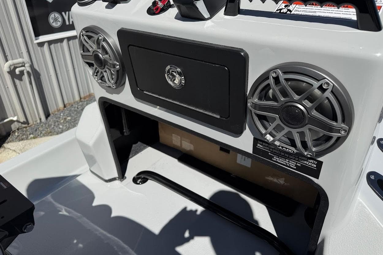 2026 SCB R24 boat console with speakers and storage compartment.