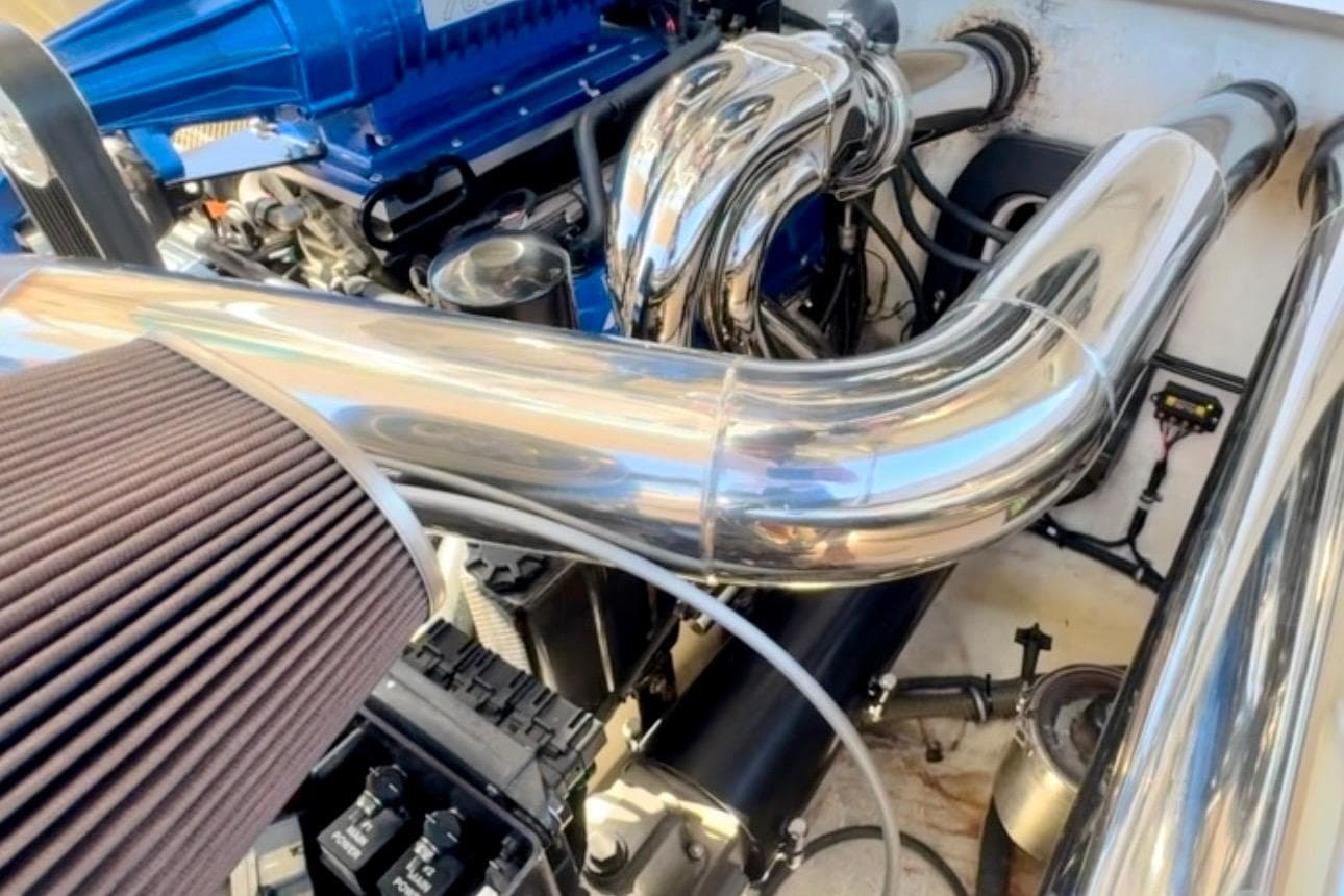 Engine compartment of a 2015 Donzi 38 ZR with polished metal components.