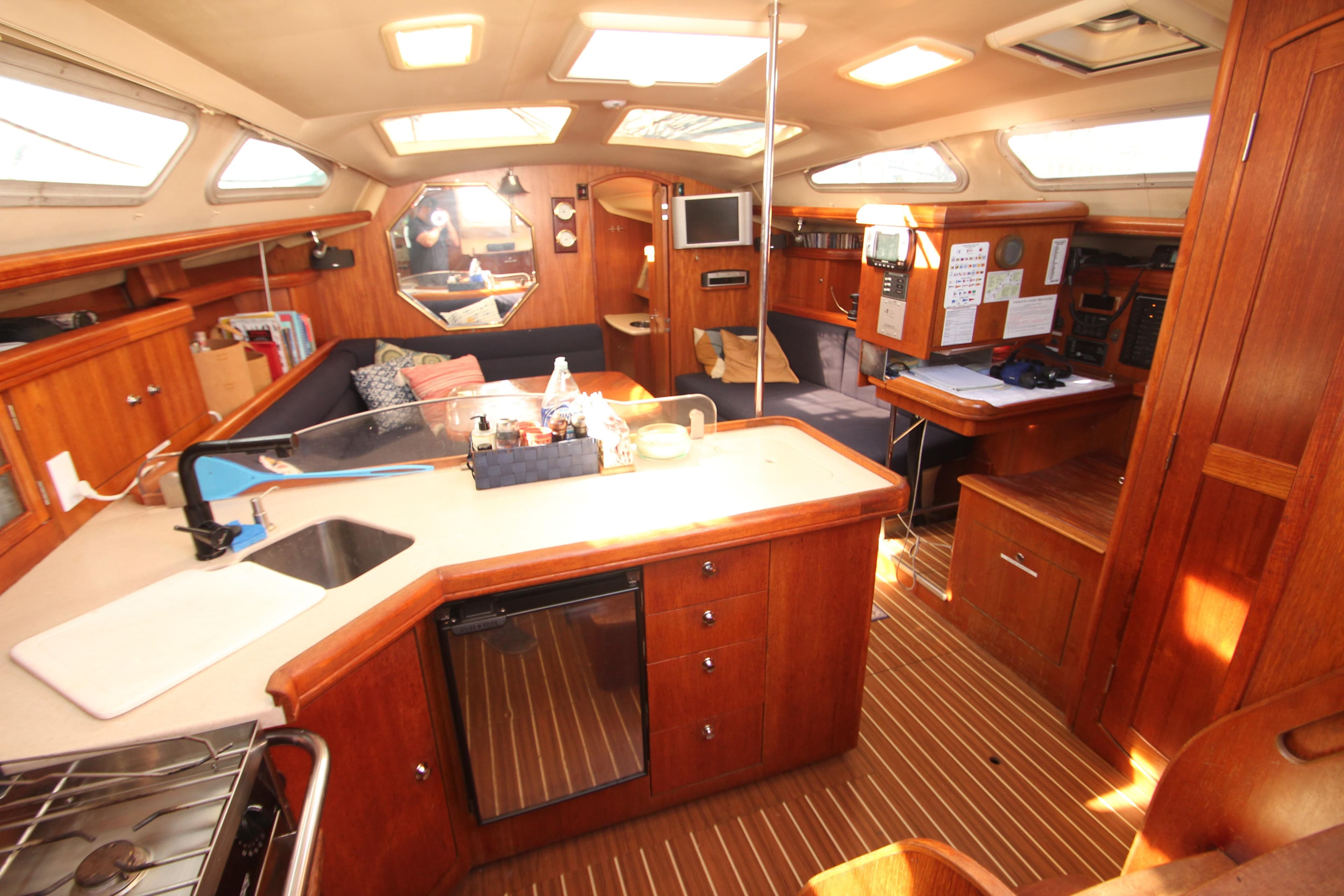 Interior of 2005 Hunter 41 AC sailboat with wood finish and modern amenities.