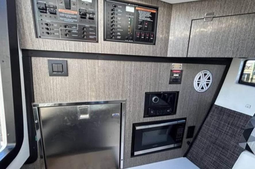 Interior of 2021 Monterey 385SE Super Express with control panels and appliances.