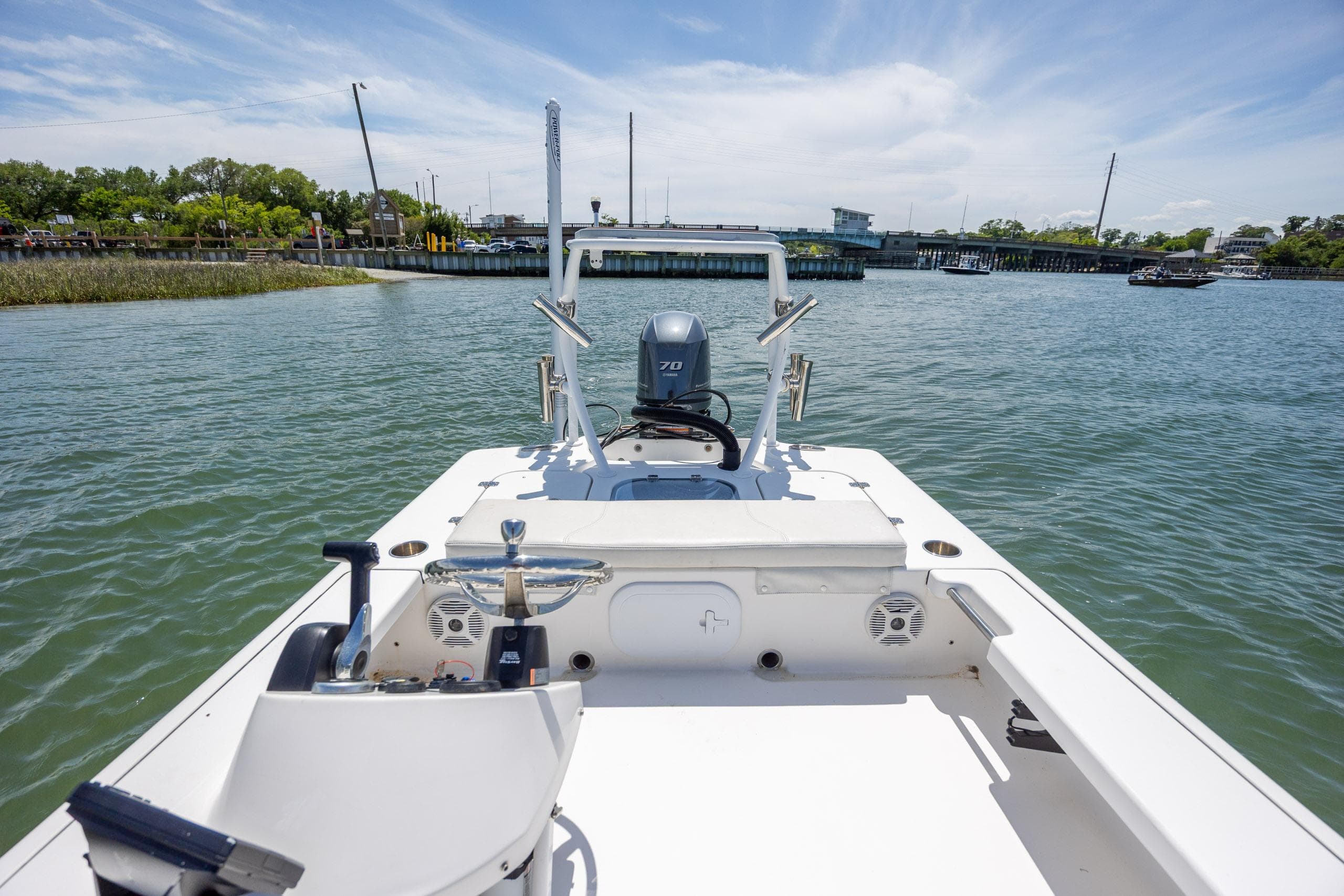 2018 Bomb Island 160 SC boat on water, clear sky, and distant shoreline.