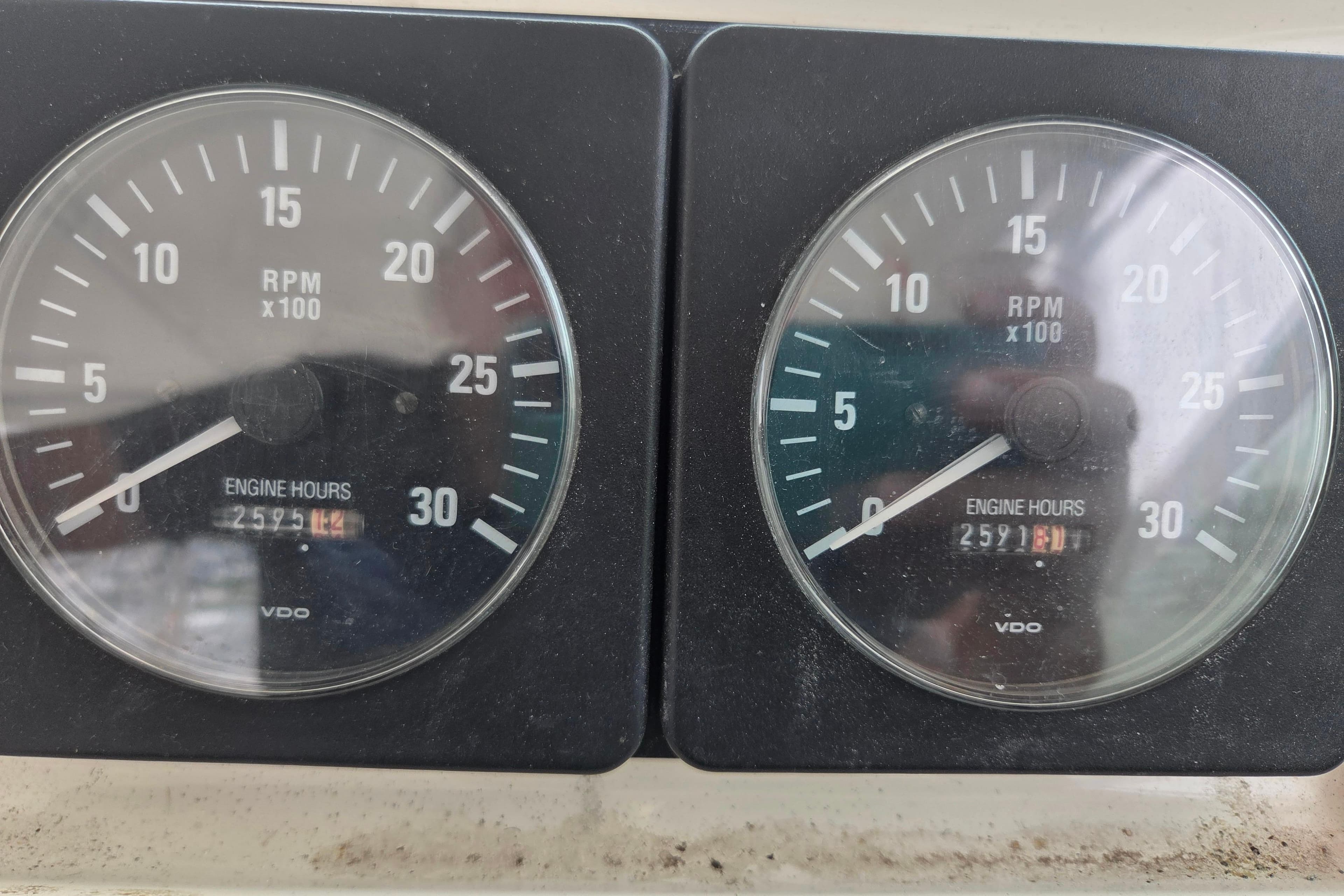 RPM gauges of a 1999 Cabo 35 Express boat showing engine hours.