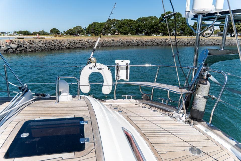 Luxury Discovery 55 yacht deck, 2008 model, with scenic waterfront view.