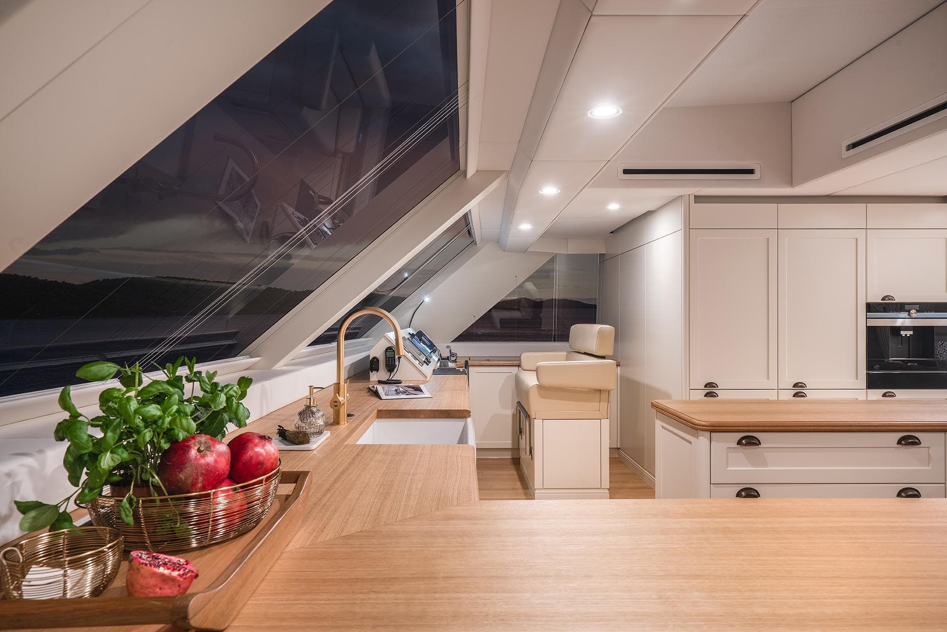 Luxurious kitchen interior of 2026 Sunreef 100 Power yacht with modern design and wooden accents.