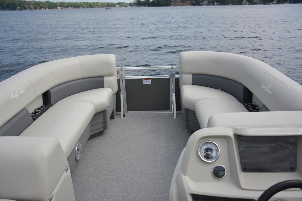 Manufacturer Provided Image: 2024 SunChaser Vista 18 LR pontoon boat interior with comfortable seating on a lake.