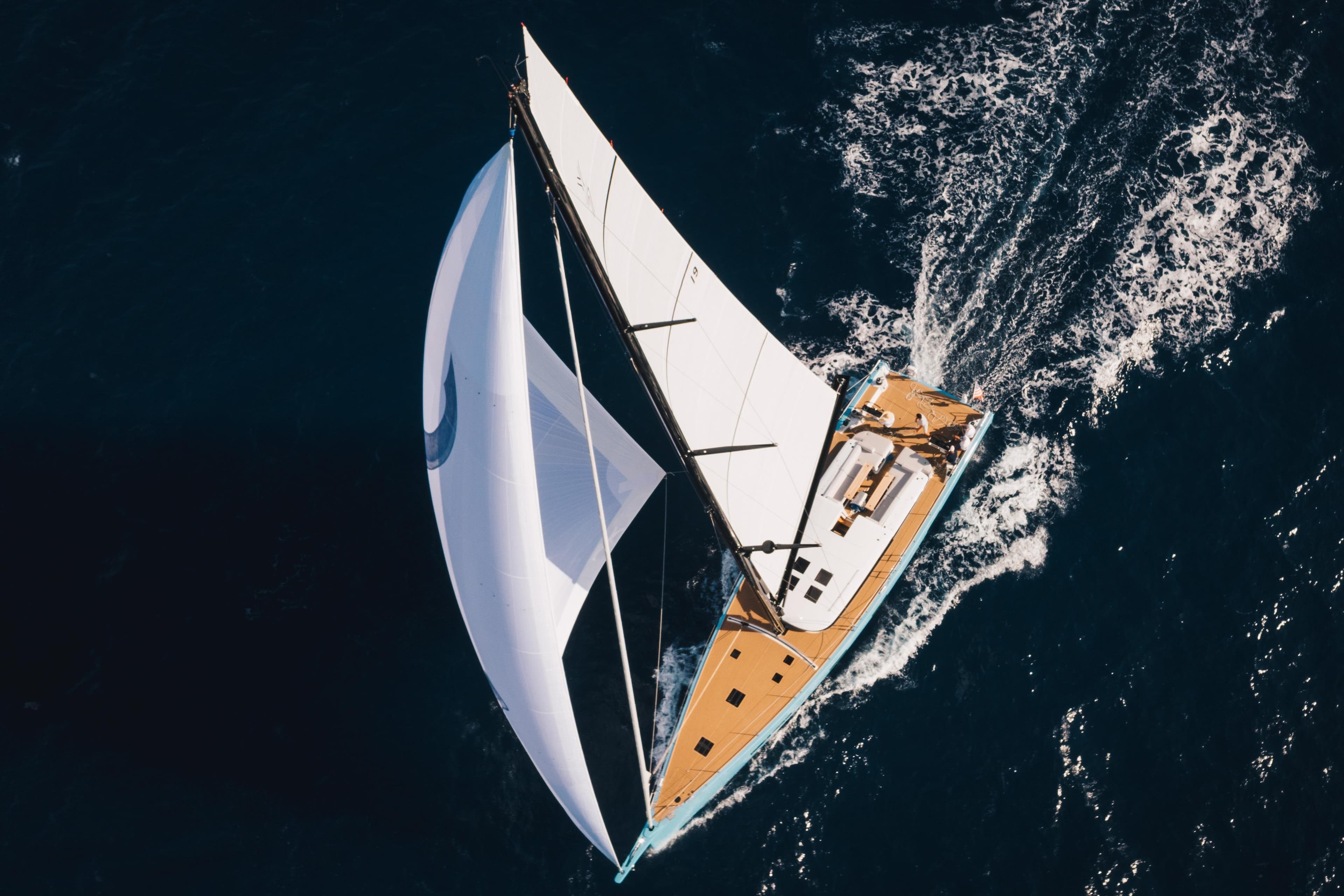 Aerial view of 2022 YYachts Y7 sailing yacht on open sea.