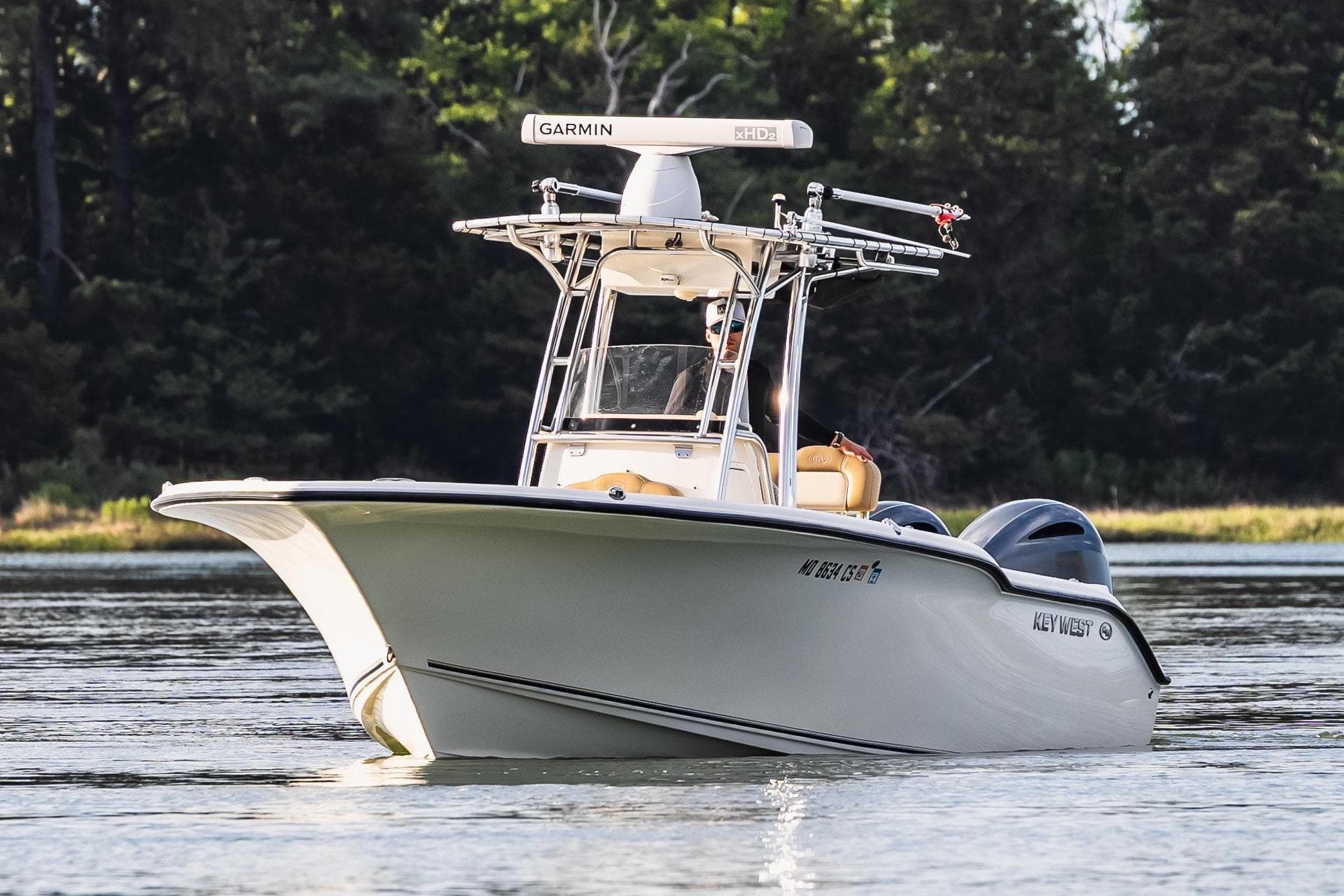 2018 Key West 244 Center Console boat on calm water.