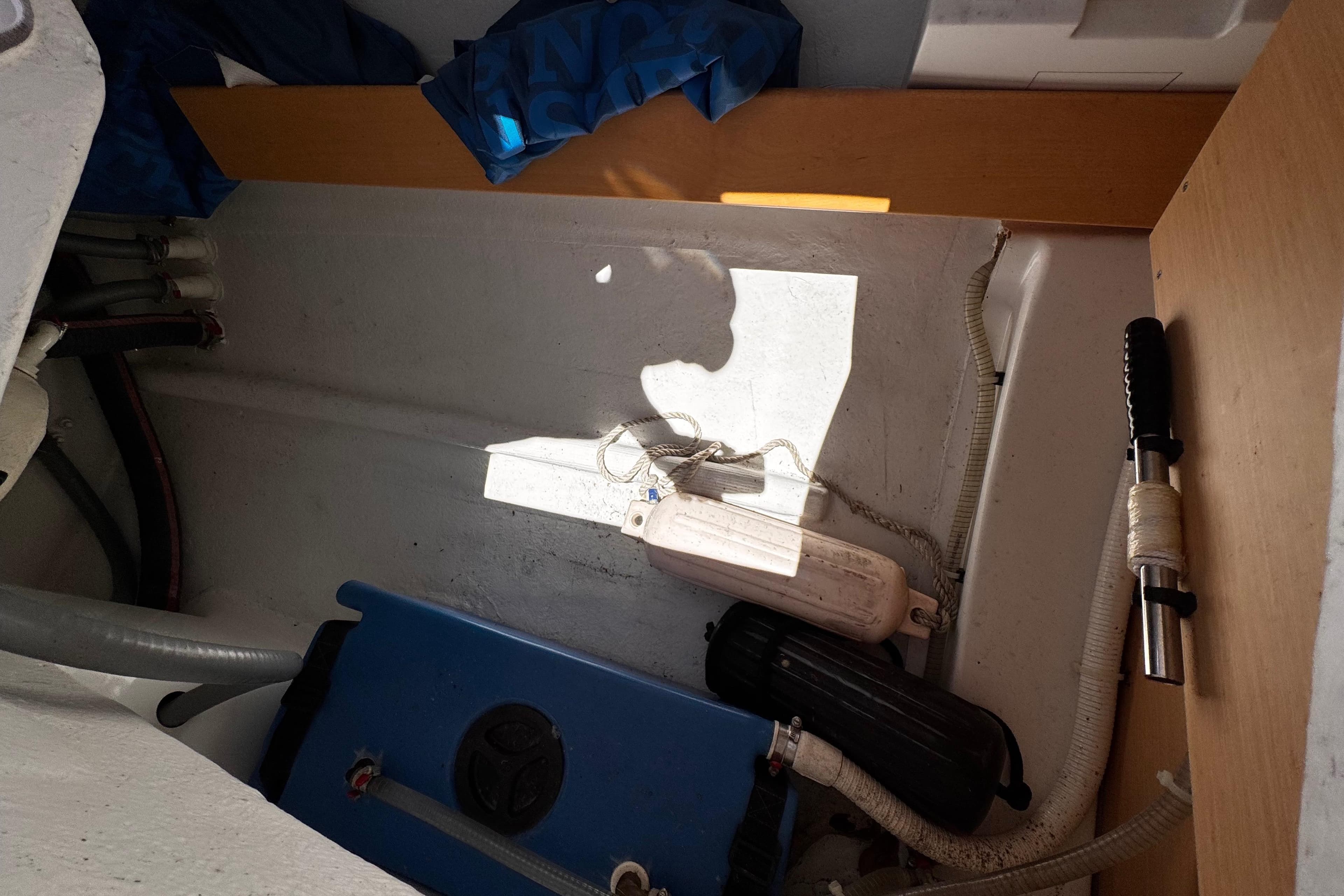 Interior view of a 2014 Beneteau FIRST 25 S sailboat showing storage and equipment.