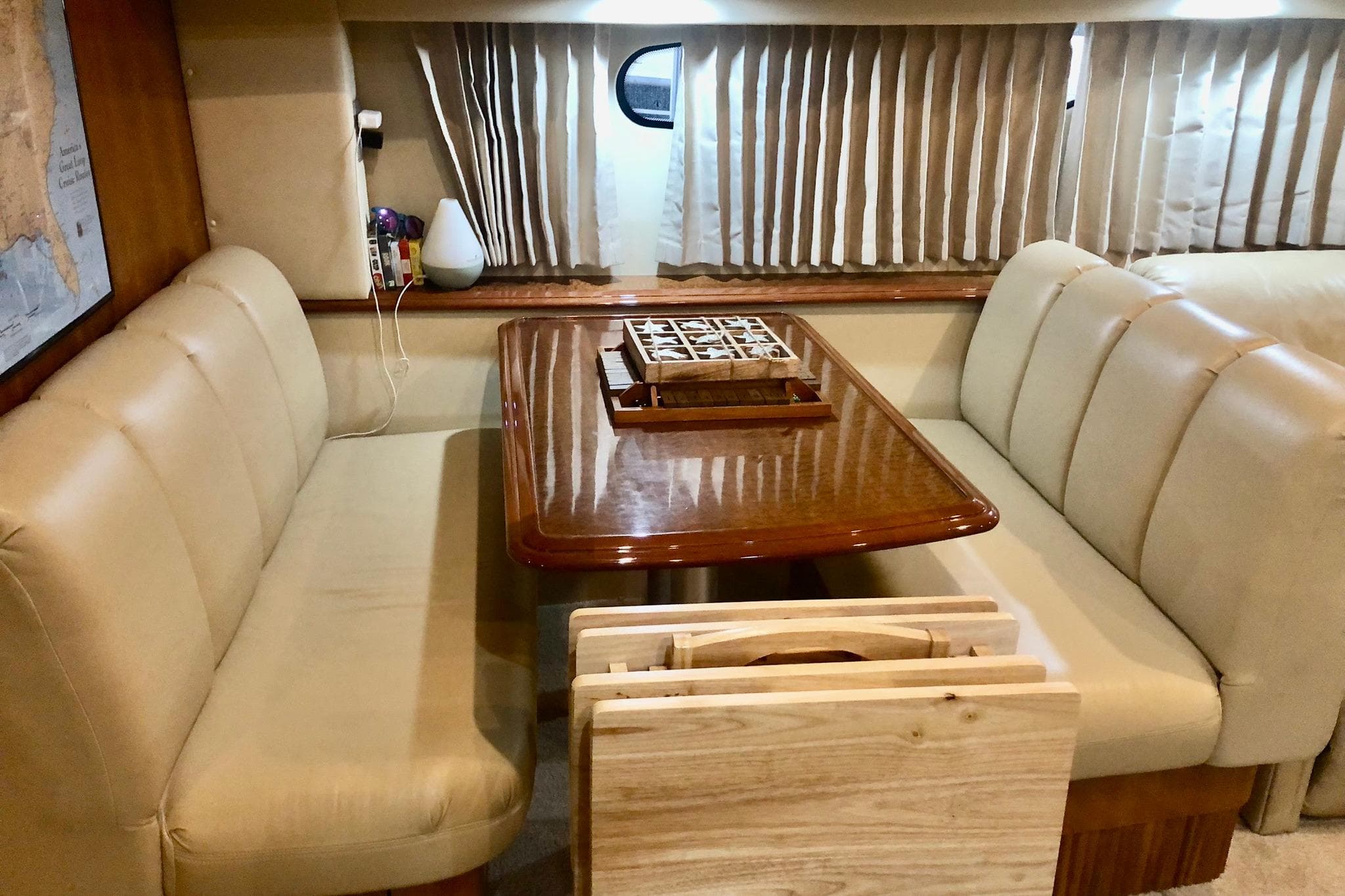 Luxurious interior of 2005 Carver 444 Cockpit Motor Yacht with elegant dining area.