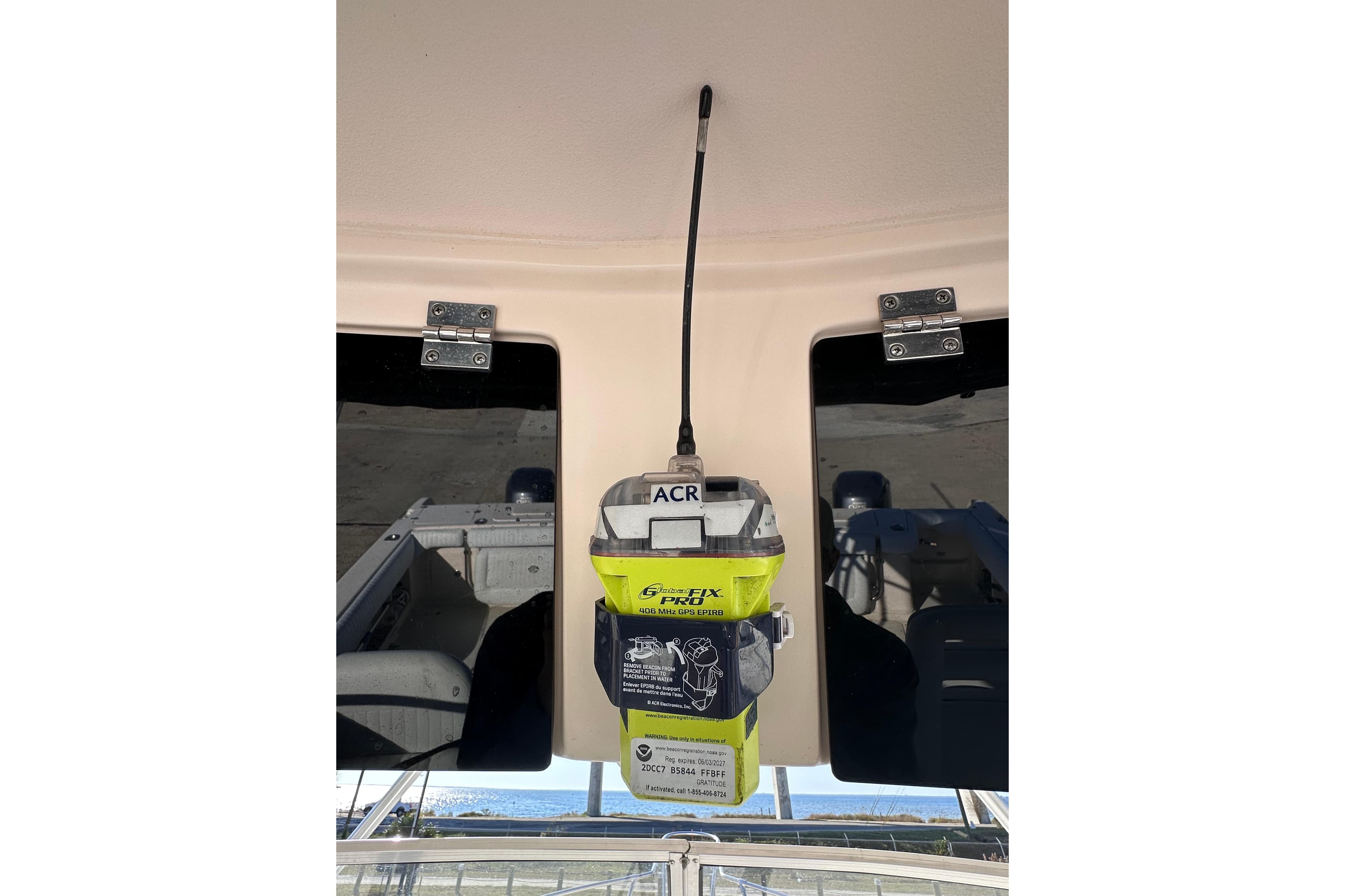 ACR GPS device mounted on 2007 Grady-White Marlin 300 boat ceiling.